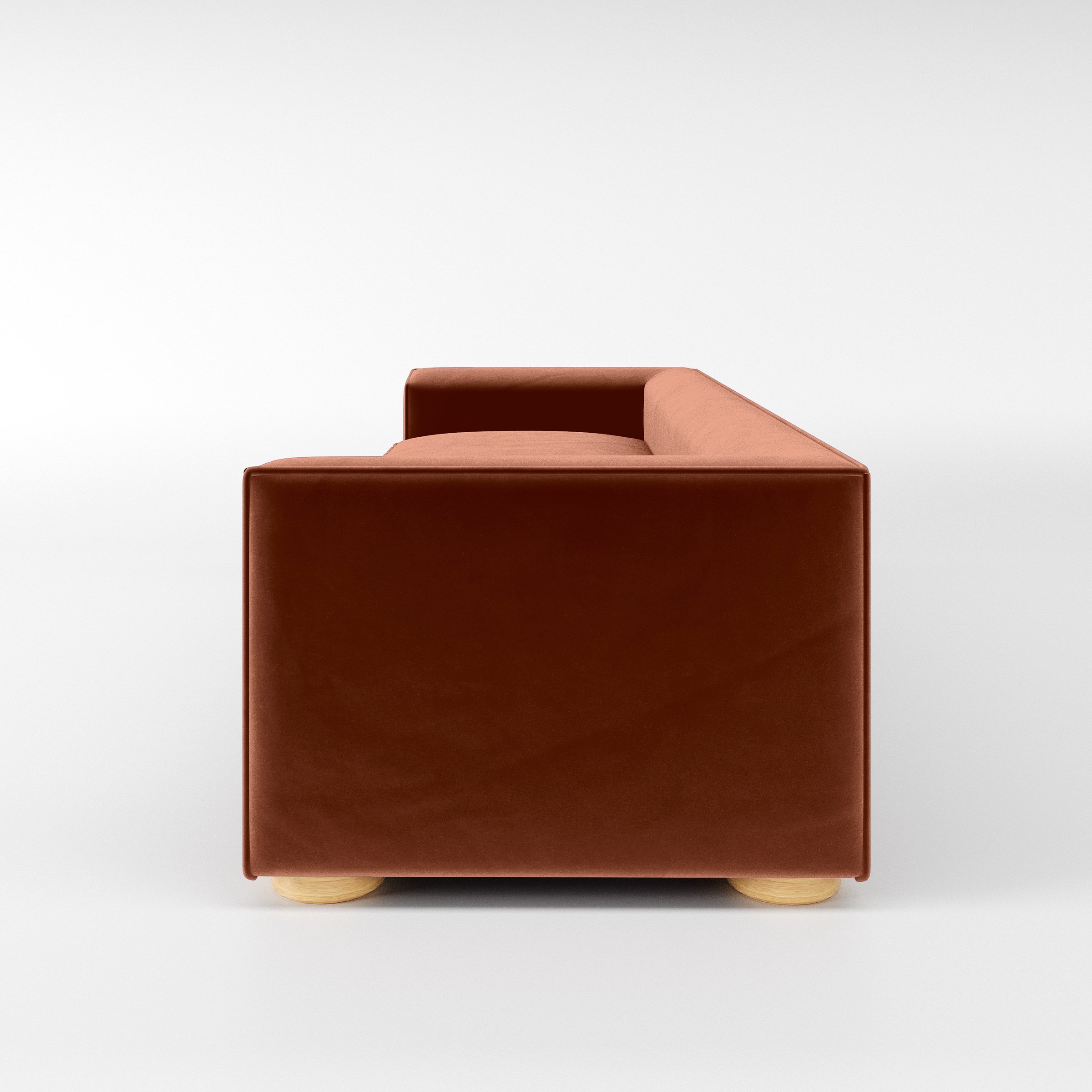 Side view of the Feale sofa upholstered in Plush EasyClean Velvet in Apricot.