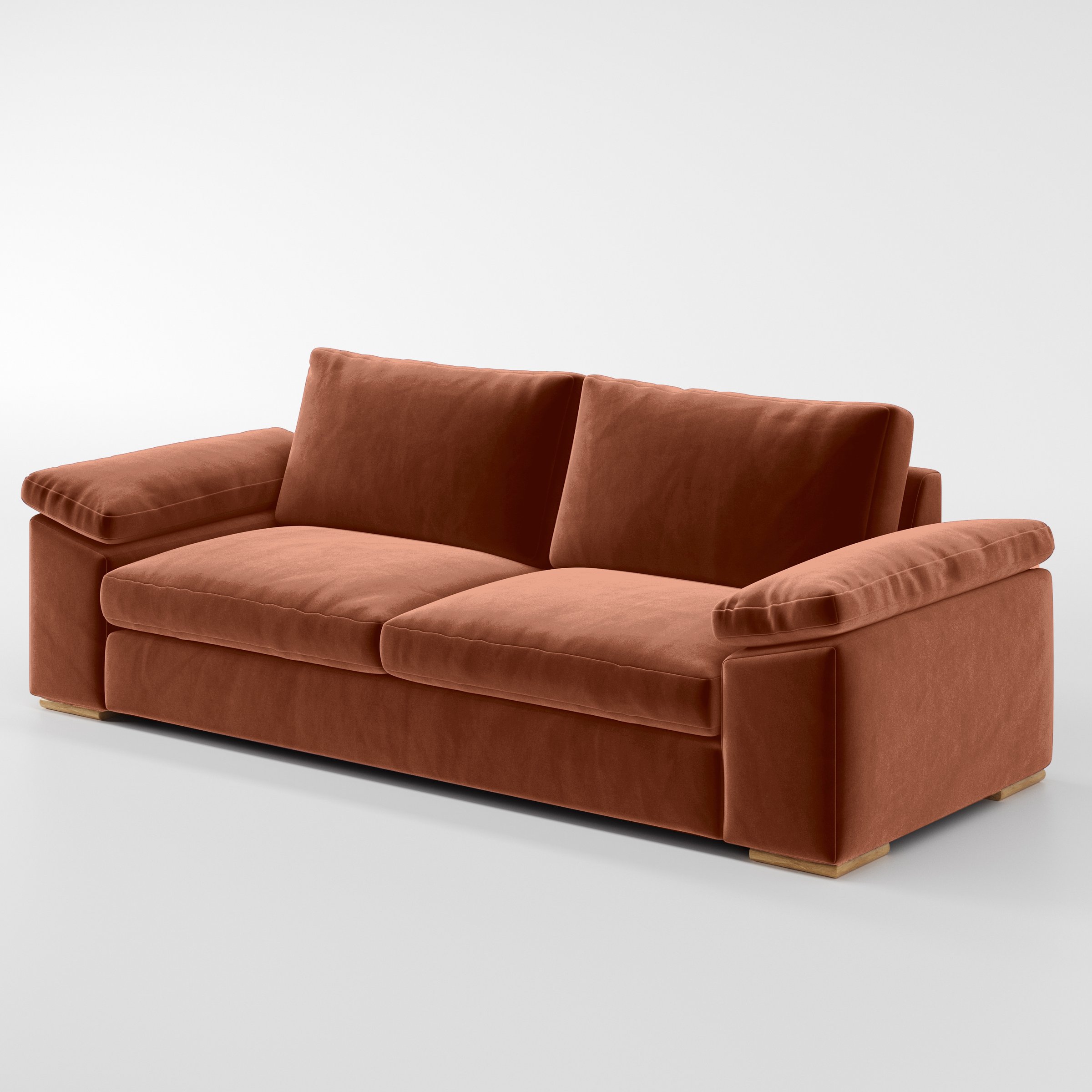 Diagonal view of the Moy sofa upholstered in Plush EasyClean Velvet in Apricot.