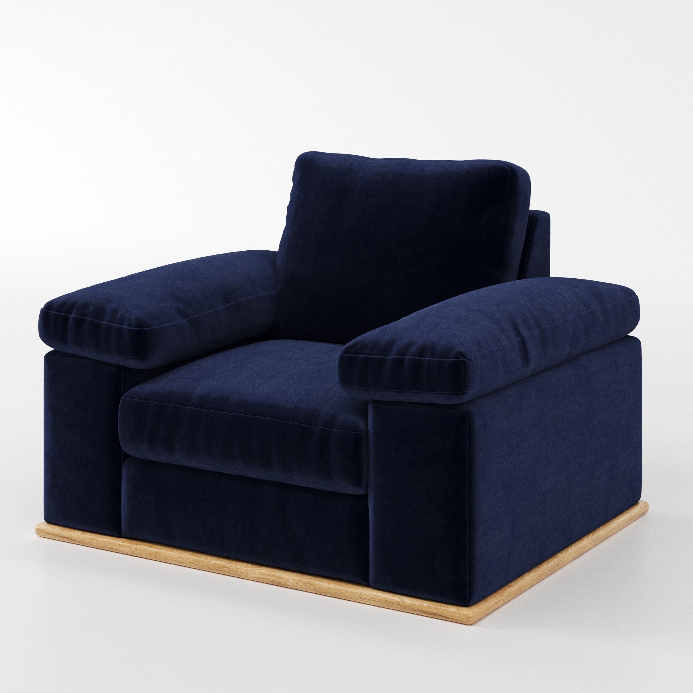 Cusher armchair in Noss Velvet Navy shown at a diagonal angle highlighting arms and seat depth.