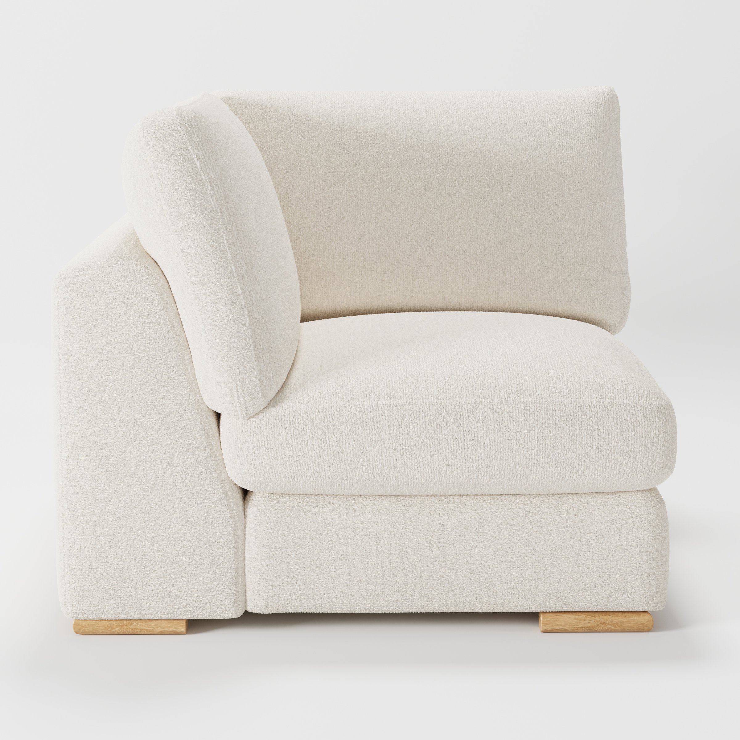 Olton corner unit in Kilda bouclé cream fabric, left side view showing sculpted arm and light texture