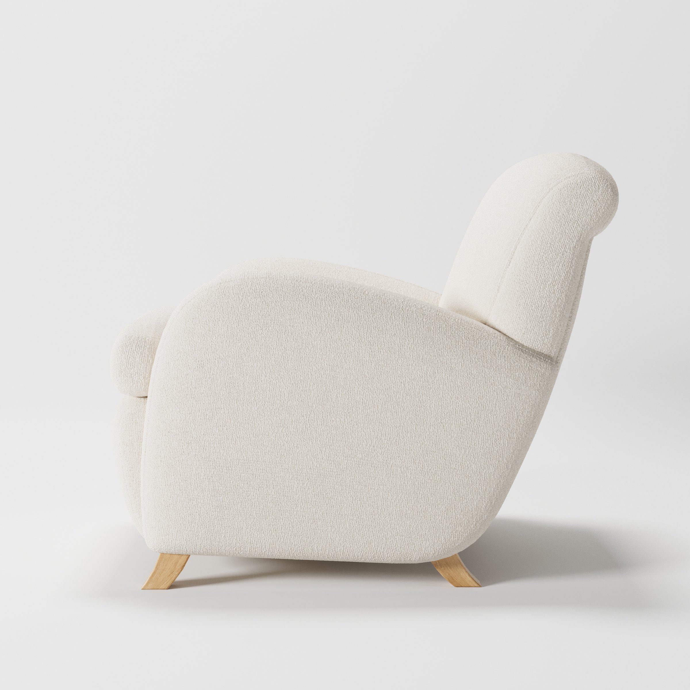 Rye armchair in Kilda Boucle Cream shown in side profile displaying proportions and overall silhouette.