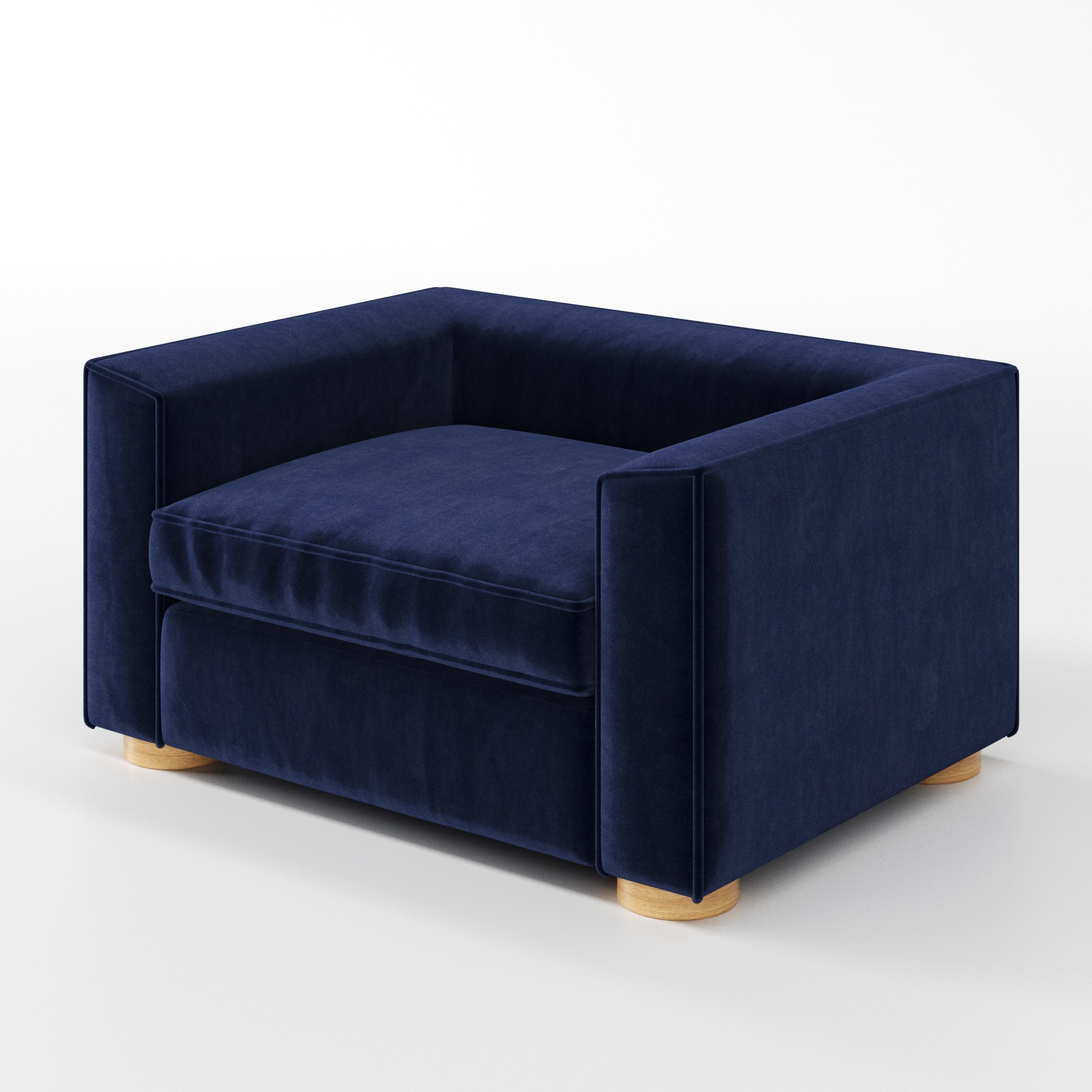 Feale armchair in Noss Velvet Navy shown at a diagonal angle highlighting arms and seat depth.