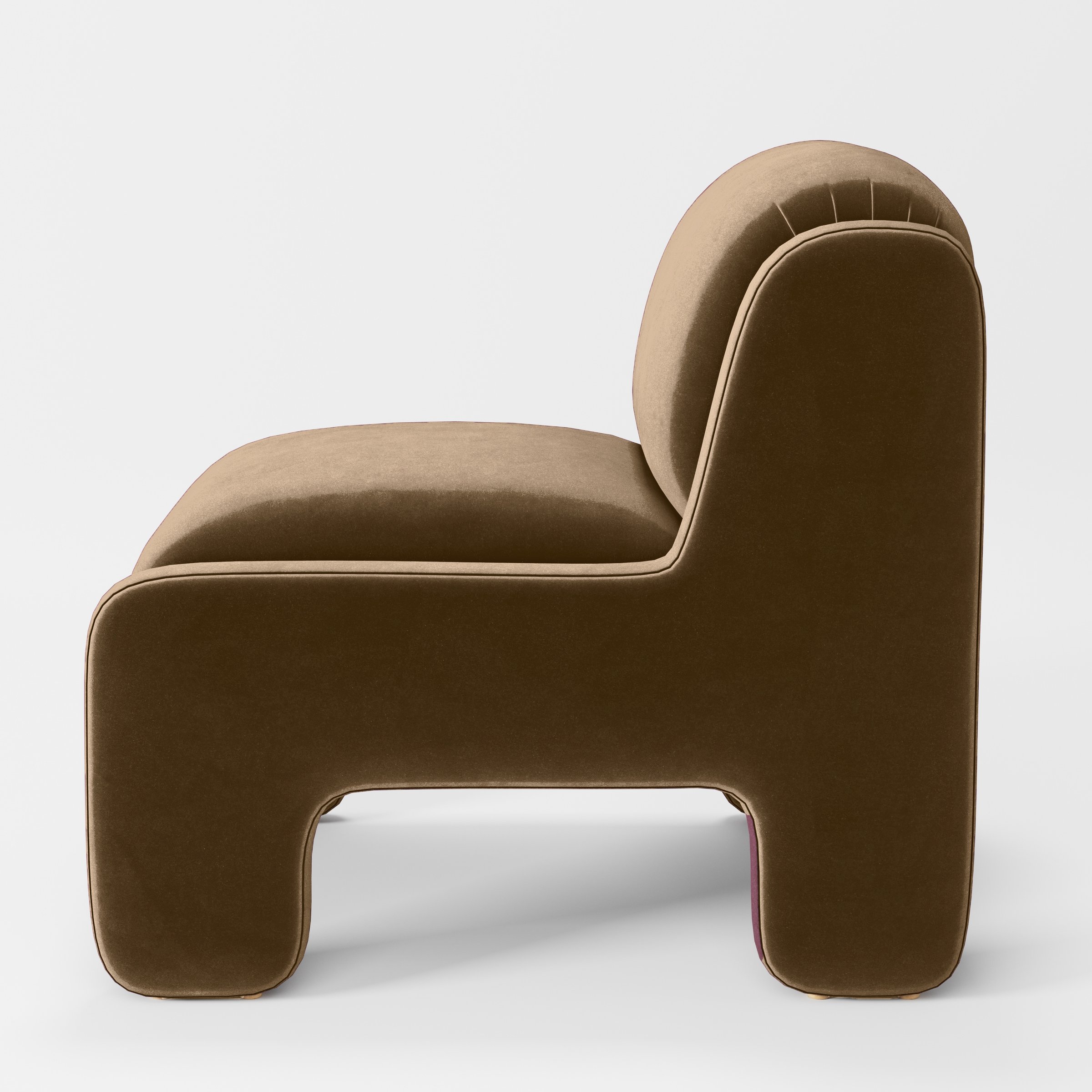 Side view of the Inny armchair upholstered in Plush EasyClean Velvet in Caribou.