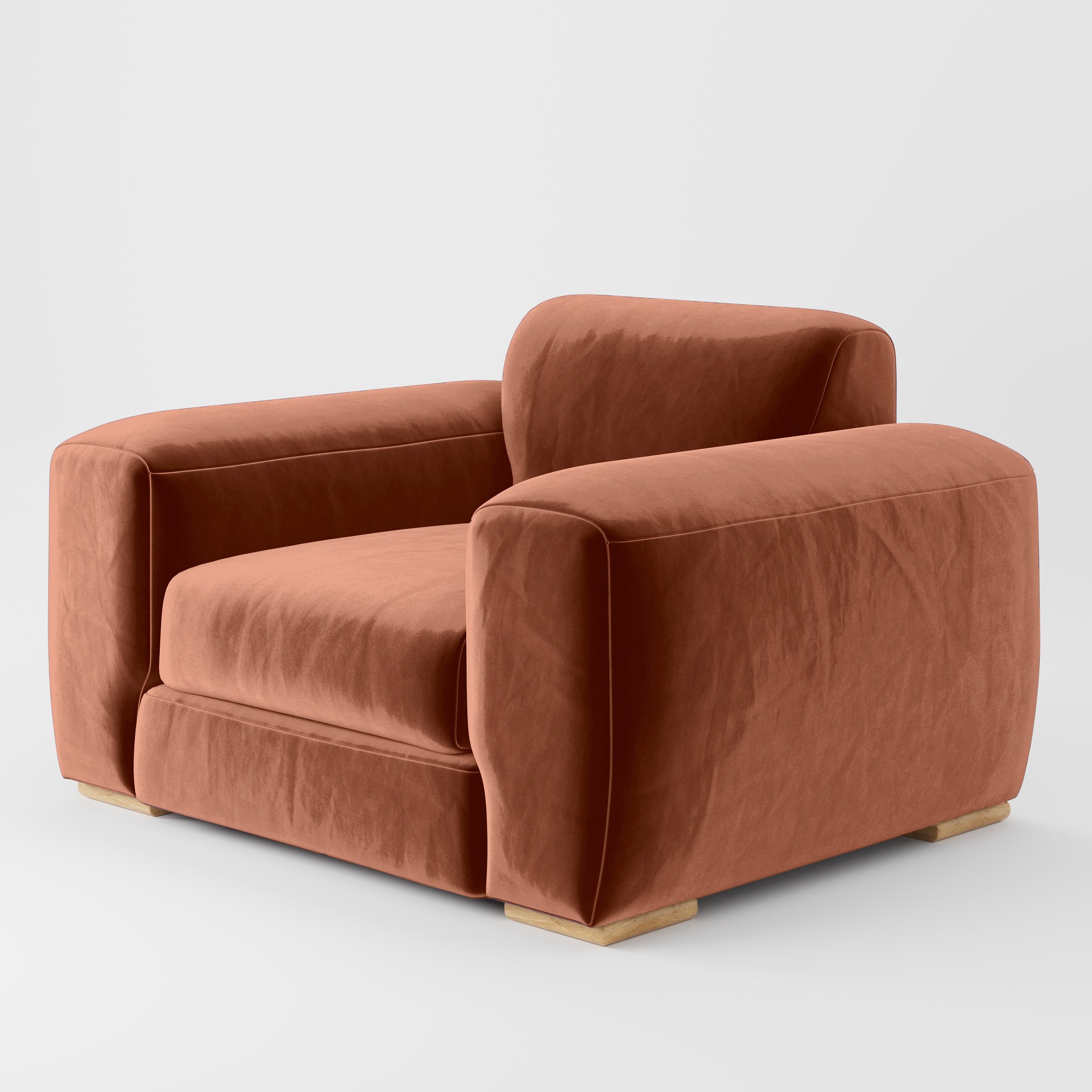 Diagonal view of the Darwell armchair upholstered in Plush EasyClean Velvet in Apricot.