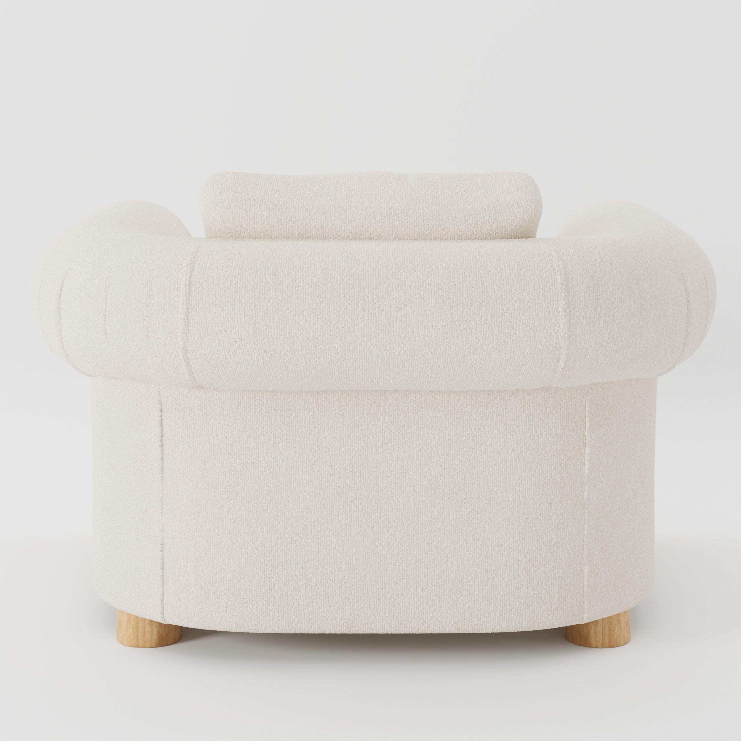 Windermere armchair in Kilda Boucle Cream shown from the rear highlighting loose covers and upholstery finish.