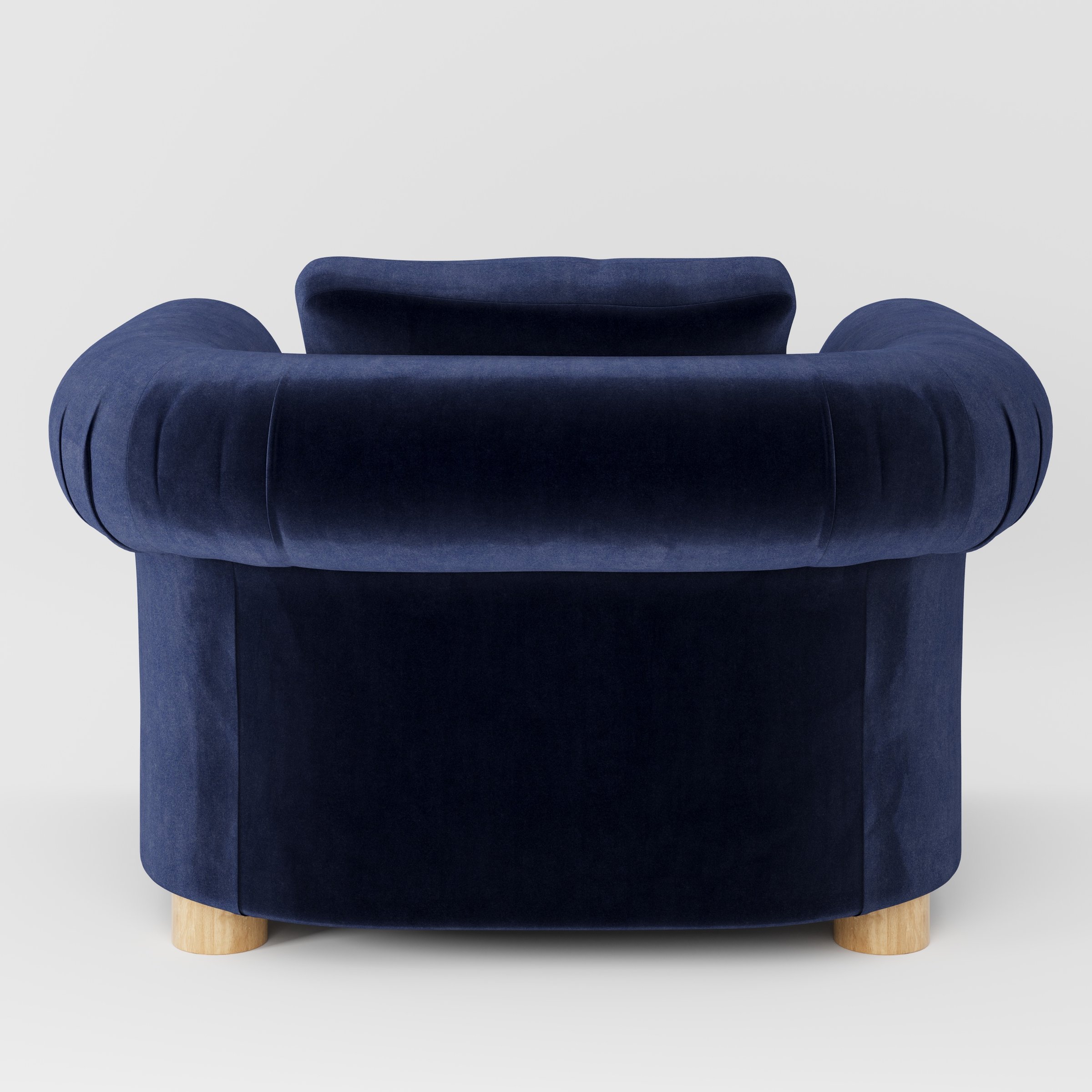 Windermere armchair in Noss Velvet Navy shown from the rear highlighting loose covers and upholstery finish.