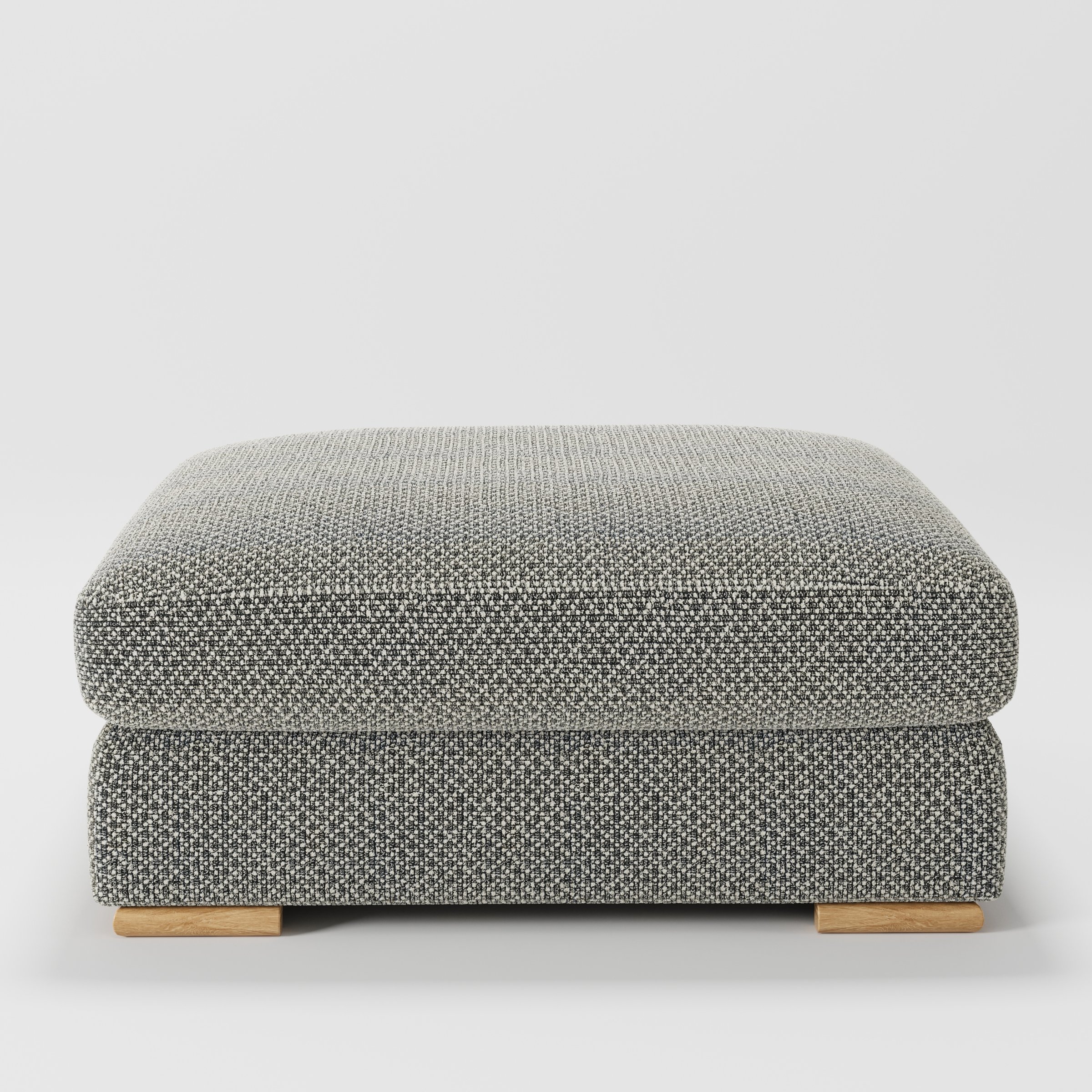 Olton footstool in Rousay Wool Blend Tar and Chalk shown front-on against a neutral studio backdrop.
