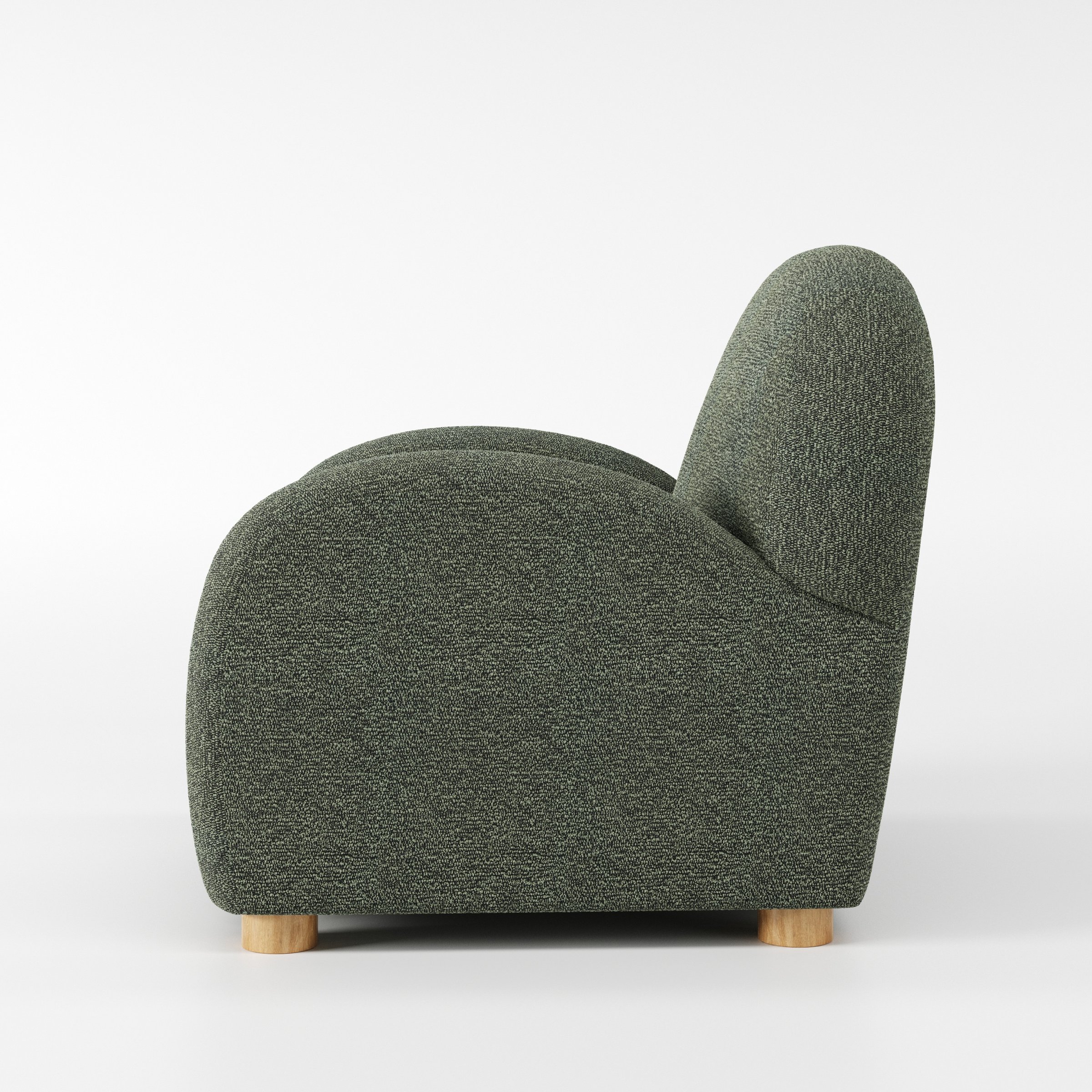 Awe armchair in Kilda Boucle Moss shown in side profile displaying proportions and overall silhouette.