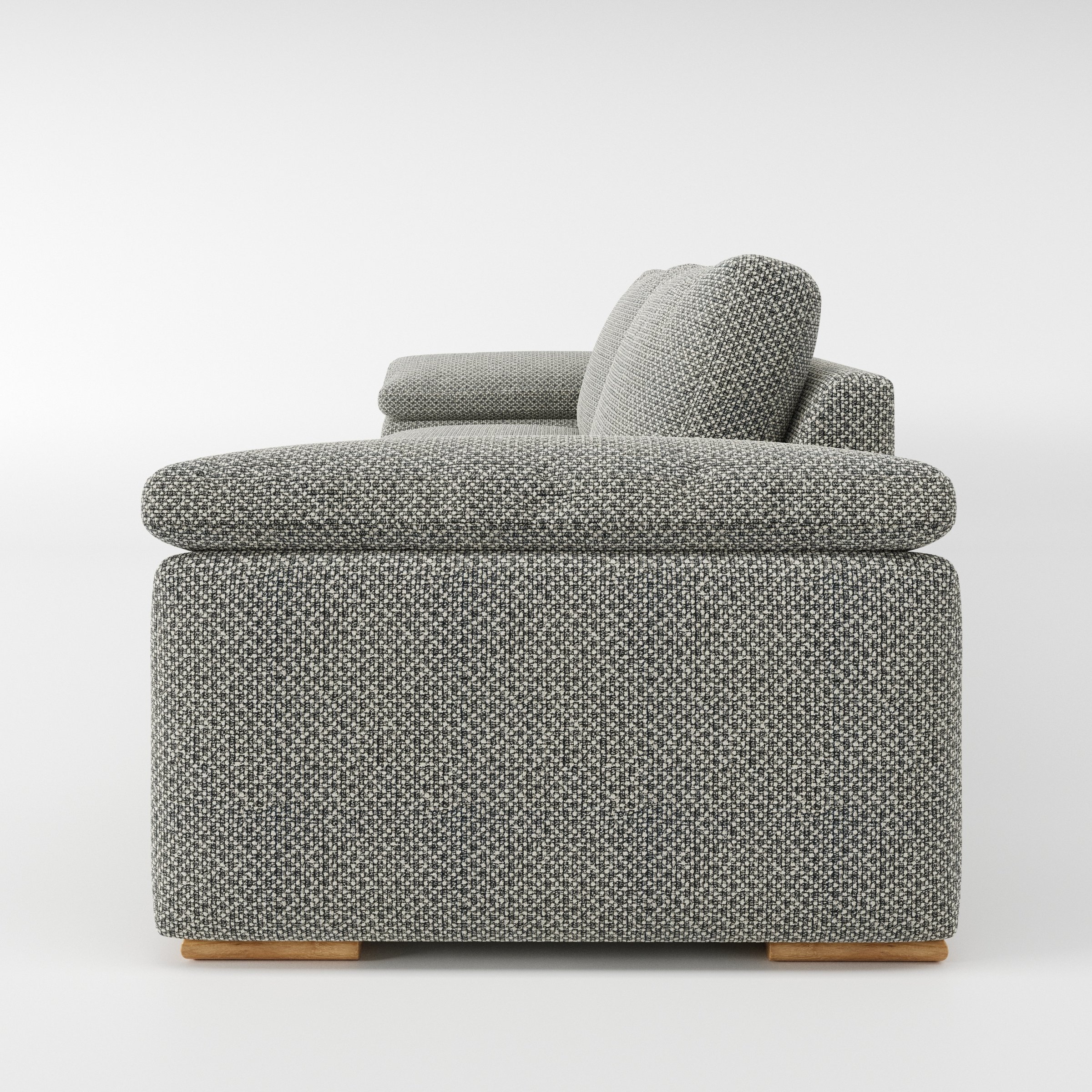 Moy sofa in Rousay Wool Blend Tar and Chalk shown in side profile displaying proportions and overall silhouette.