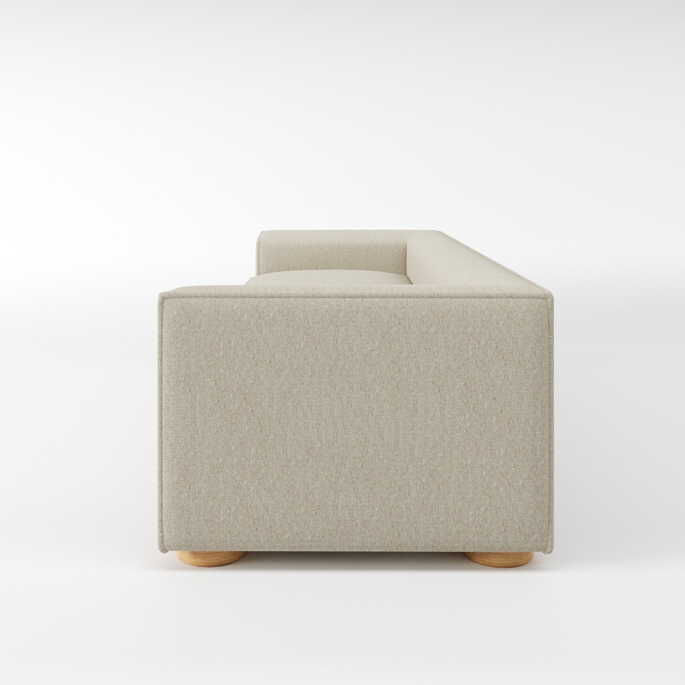 Feale sofa in Alderney Linen Oatmeal shown in side profile displaying proportions and overall silhouette.