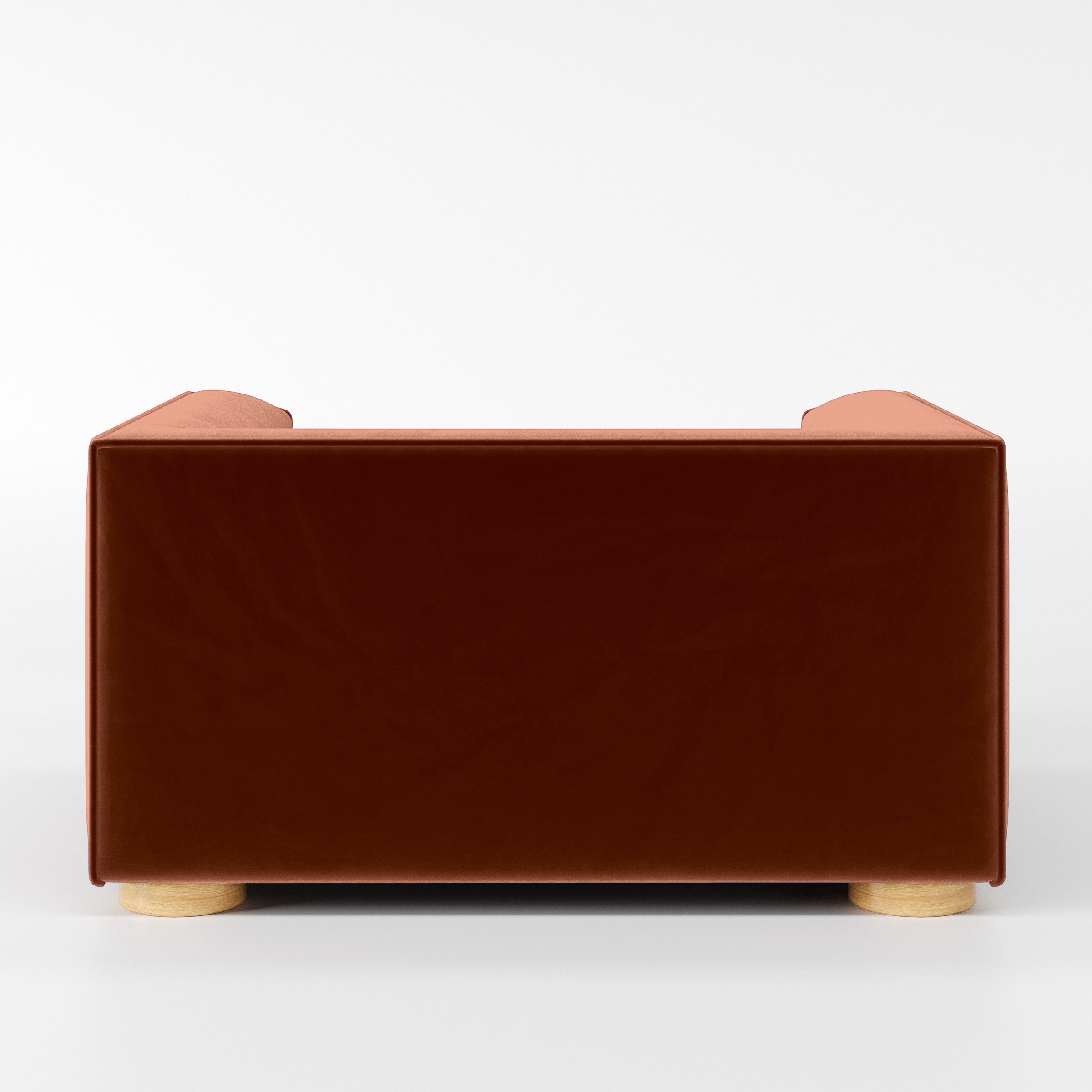 Rear view of the Feale armchair upholstered in Plush EasyClean Velvet in Apricot.