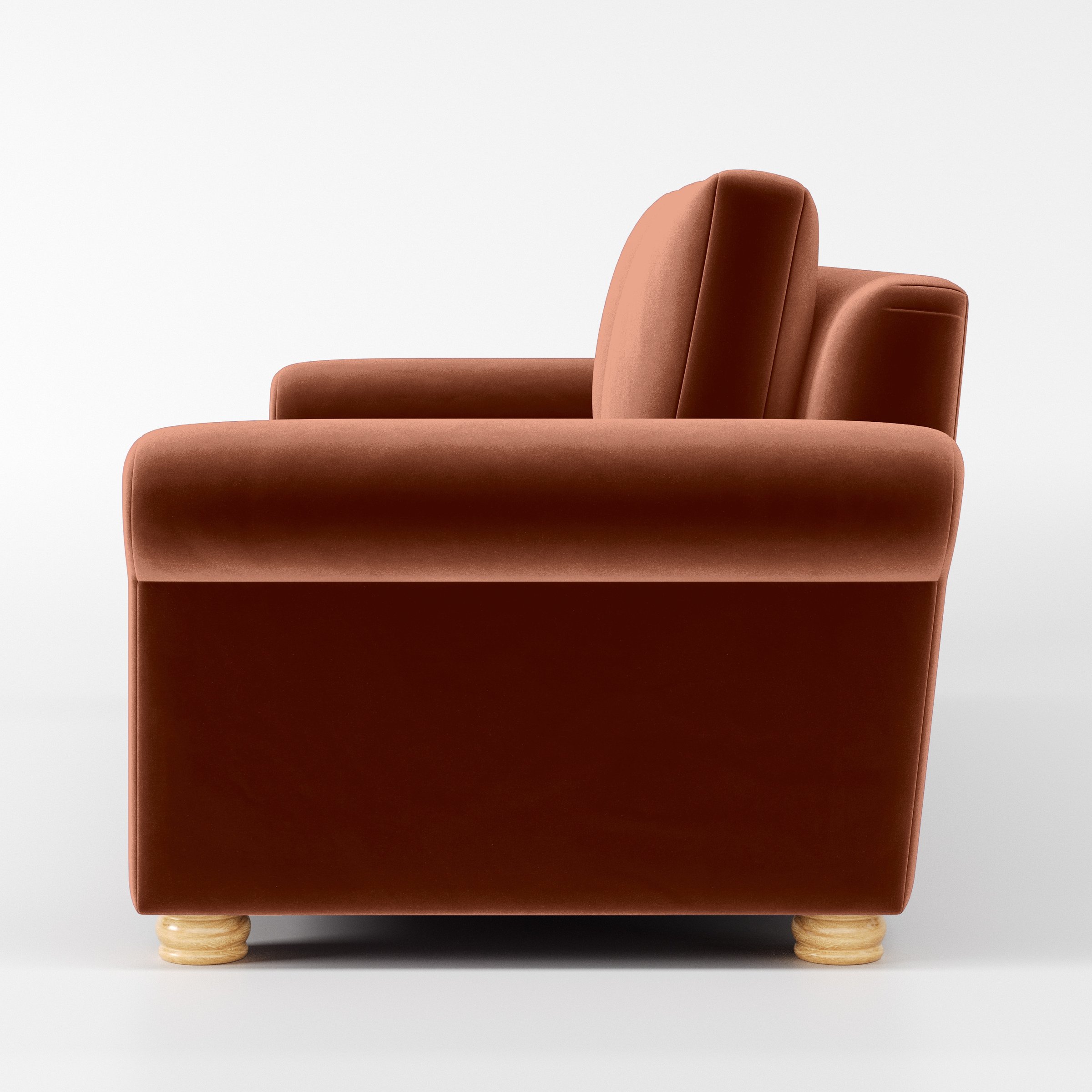 Side view of the Anna Lee sofa upholstered in Plush EasyClean Velvet in Apricot.