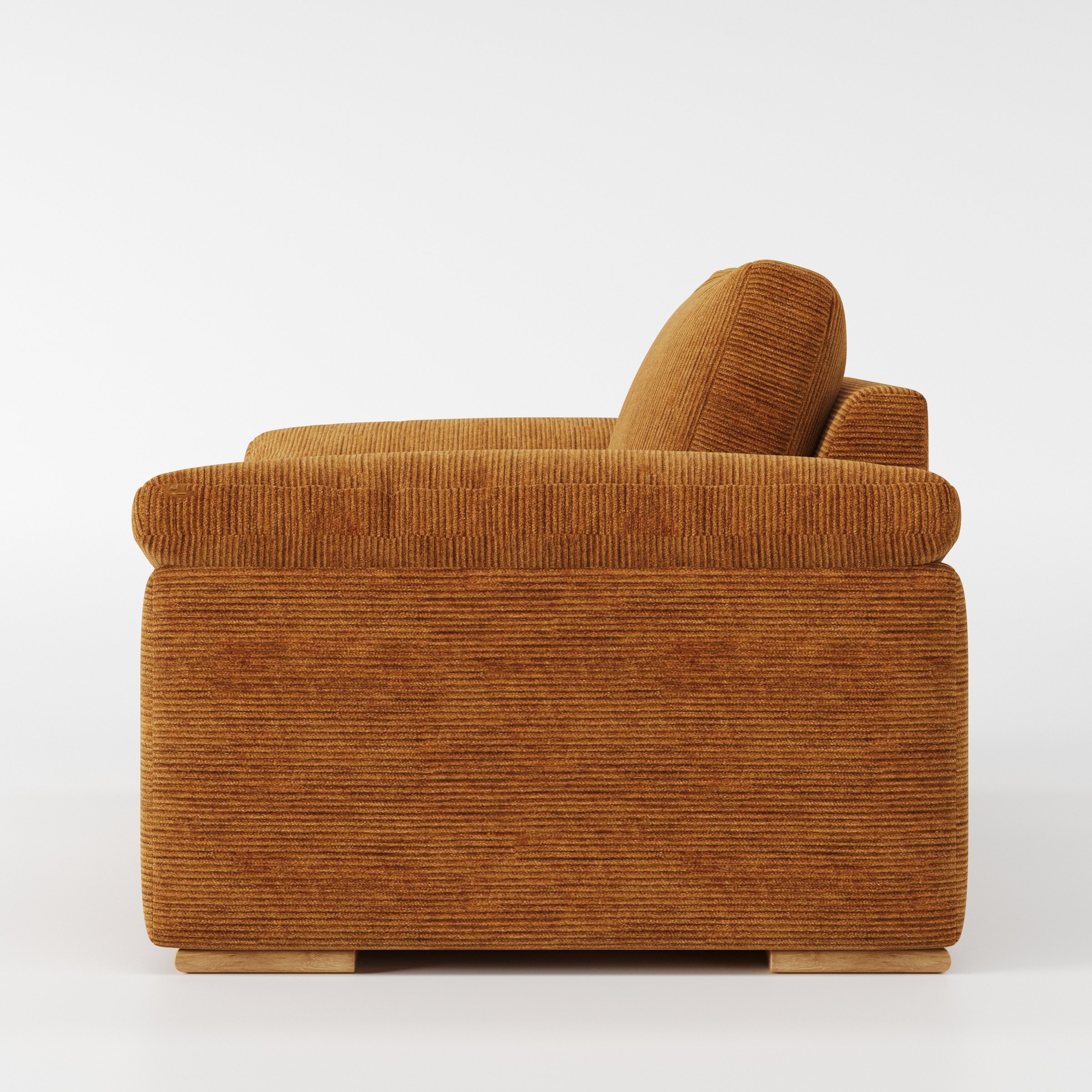 Moy armchair in Caldey Velvet Corduroy Tobacco shown in side profile displaying proportions and overall silhouette.