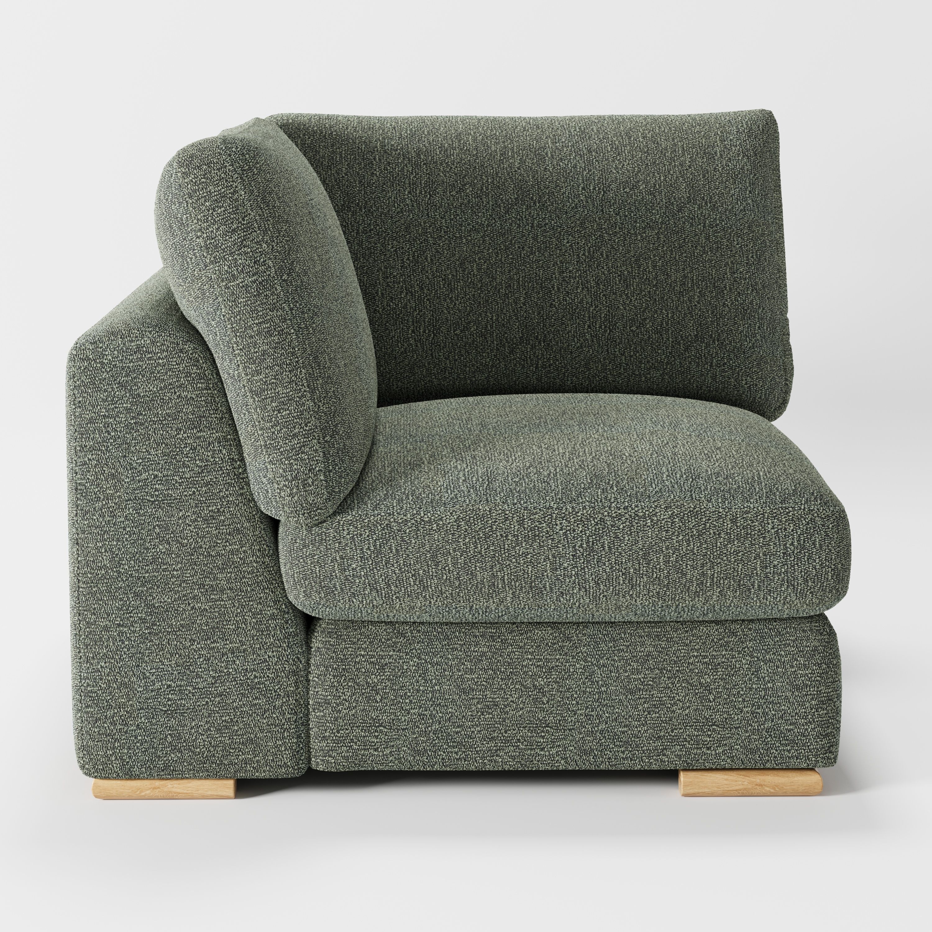 Olton corner unit in Kilda bouclé moss fabric, left side view showing arm form and dense bouclé texture