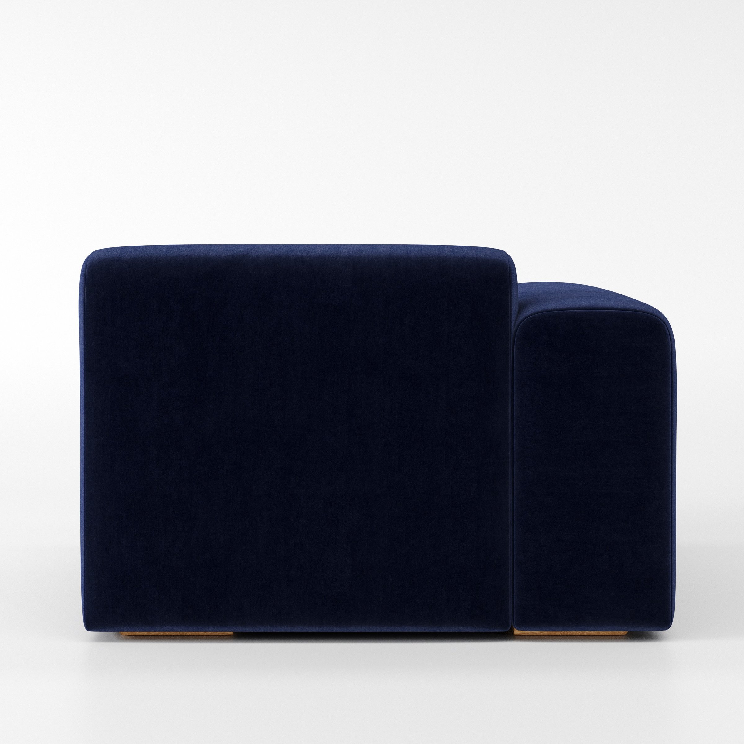 Drumquin modular sofa left side unit in Noss Velvet Navy shown from the back with a smooth, softly curved silhouette and armrest edge visible.