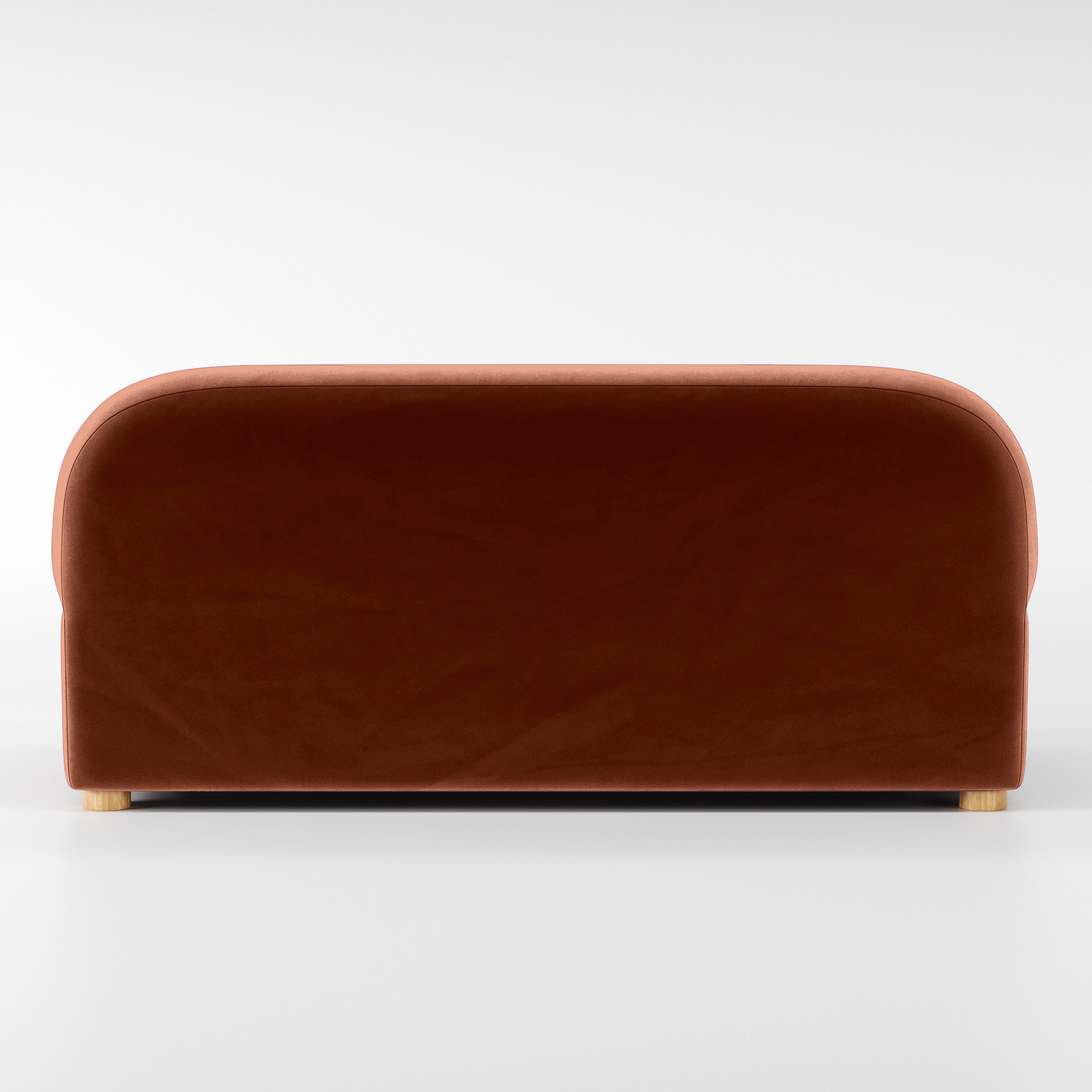 Rear view of the Awe sofa upholstered in Plush EasyClean Velvet in Apricot.