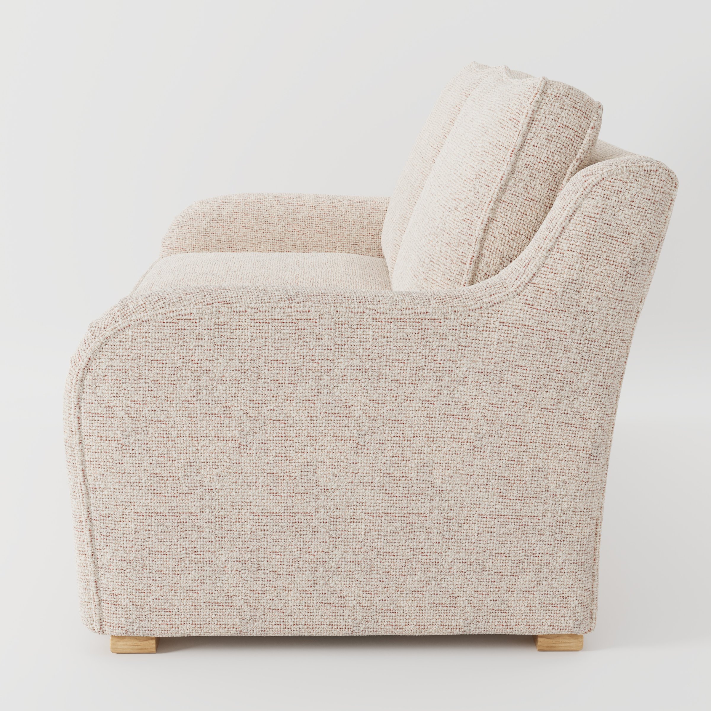 Cashel sofa in Orsay Boucle Cream and Copper shown in side profile displaying proportions and overall silhouette.