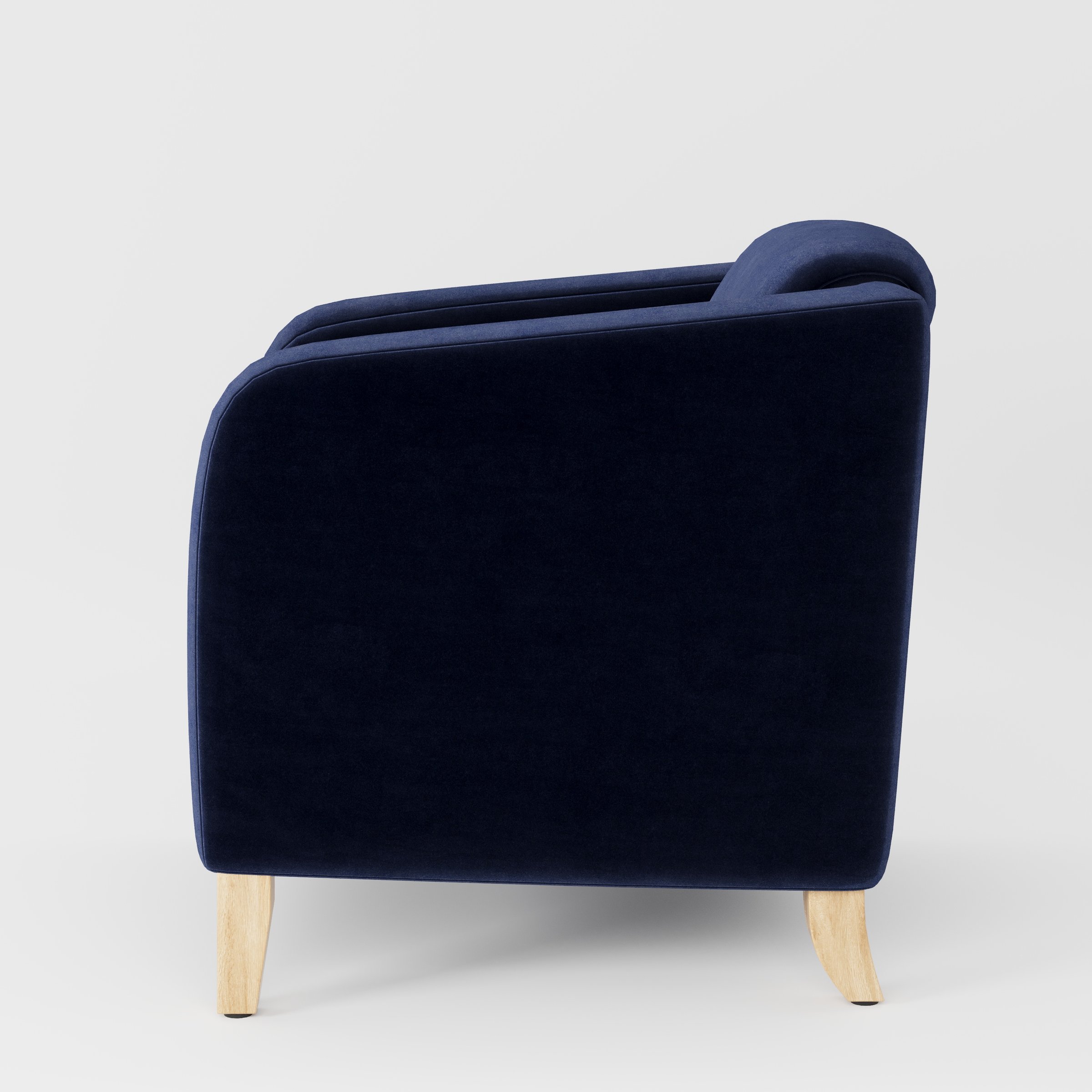 Erne armchair in Noss Velvet Navy shown in side profile displaying proportions and overall silhouette.