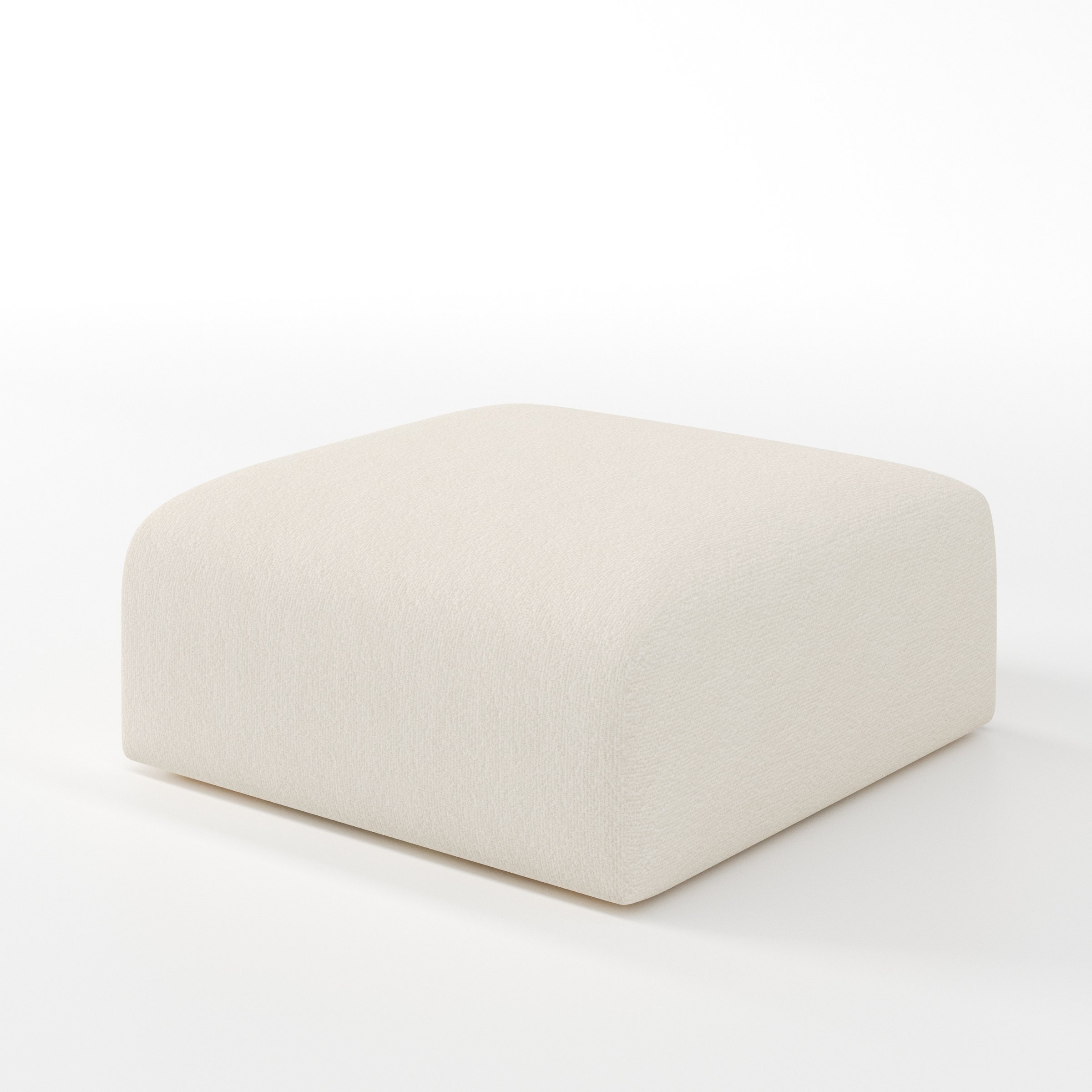 Drumquin footstool in Kilda Boucle Cream shown at a diagonal angle highlighting smooth sides and minimal silhouette.