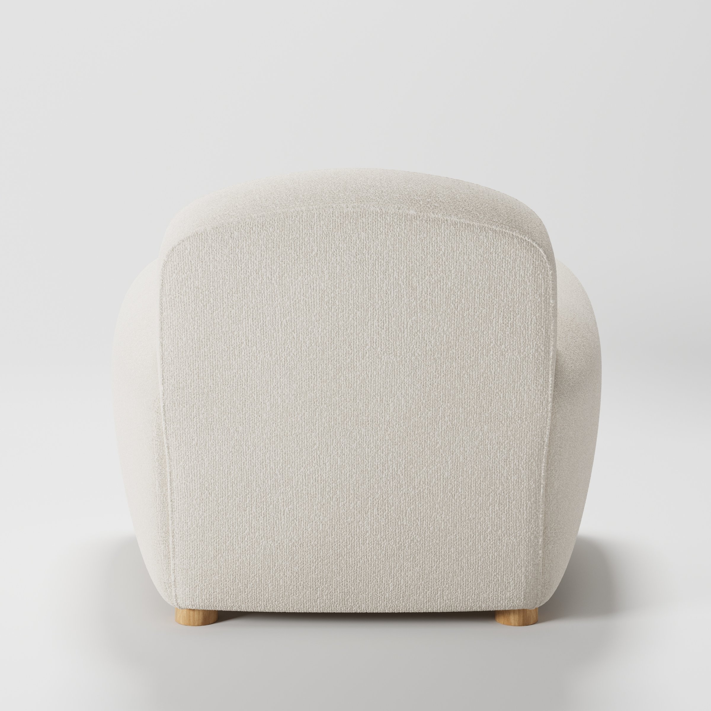 Fergus armchair in Kilda Boucle Cream shown from the rear highlighting backrest shape and upholstery finish.