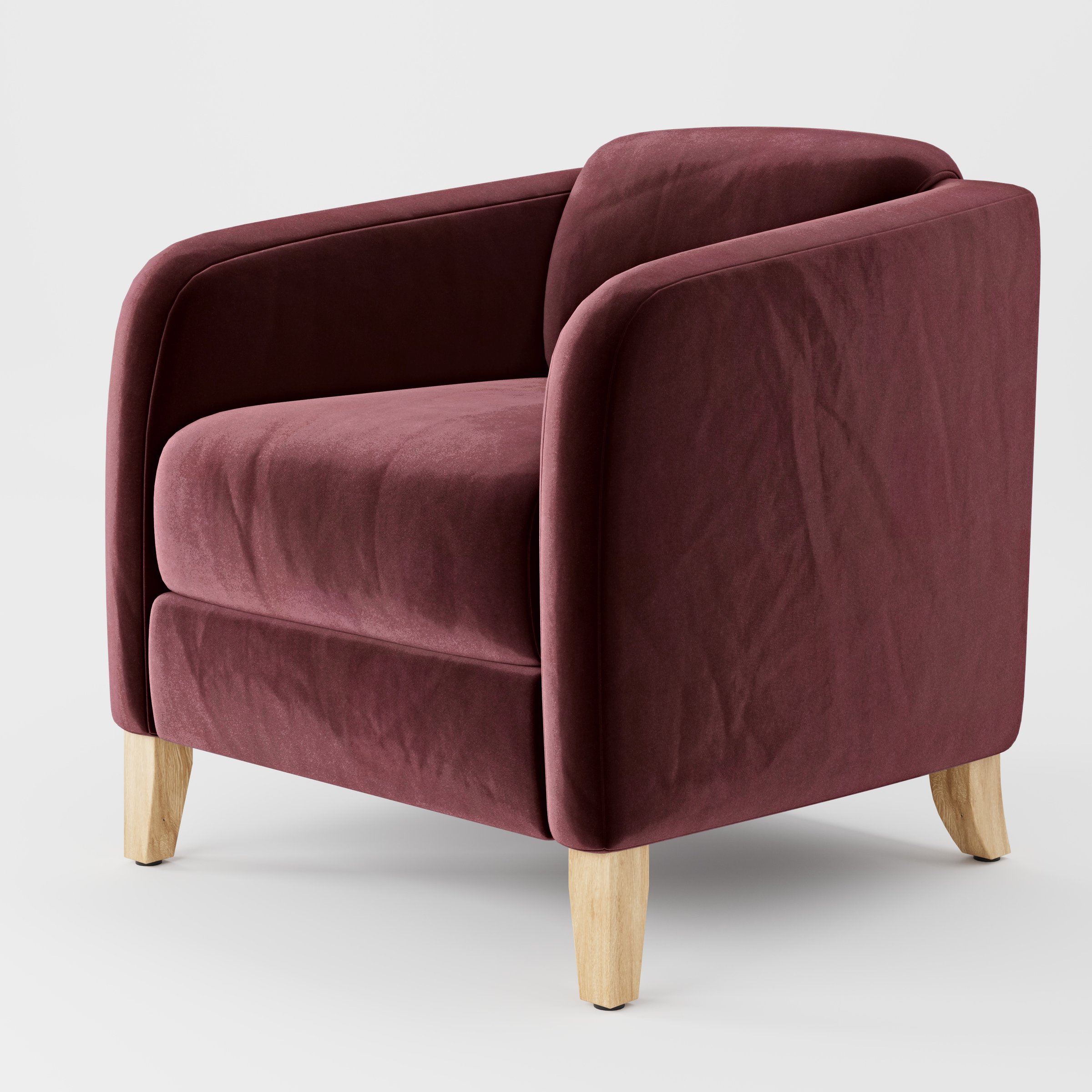 Diagonal view of the Erne armchair upholstered in Plush EasyClean Velvet in Ruby.