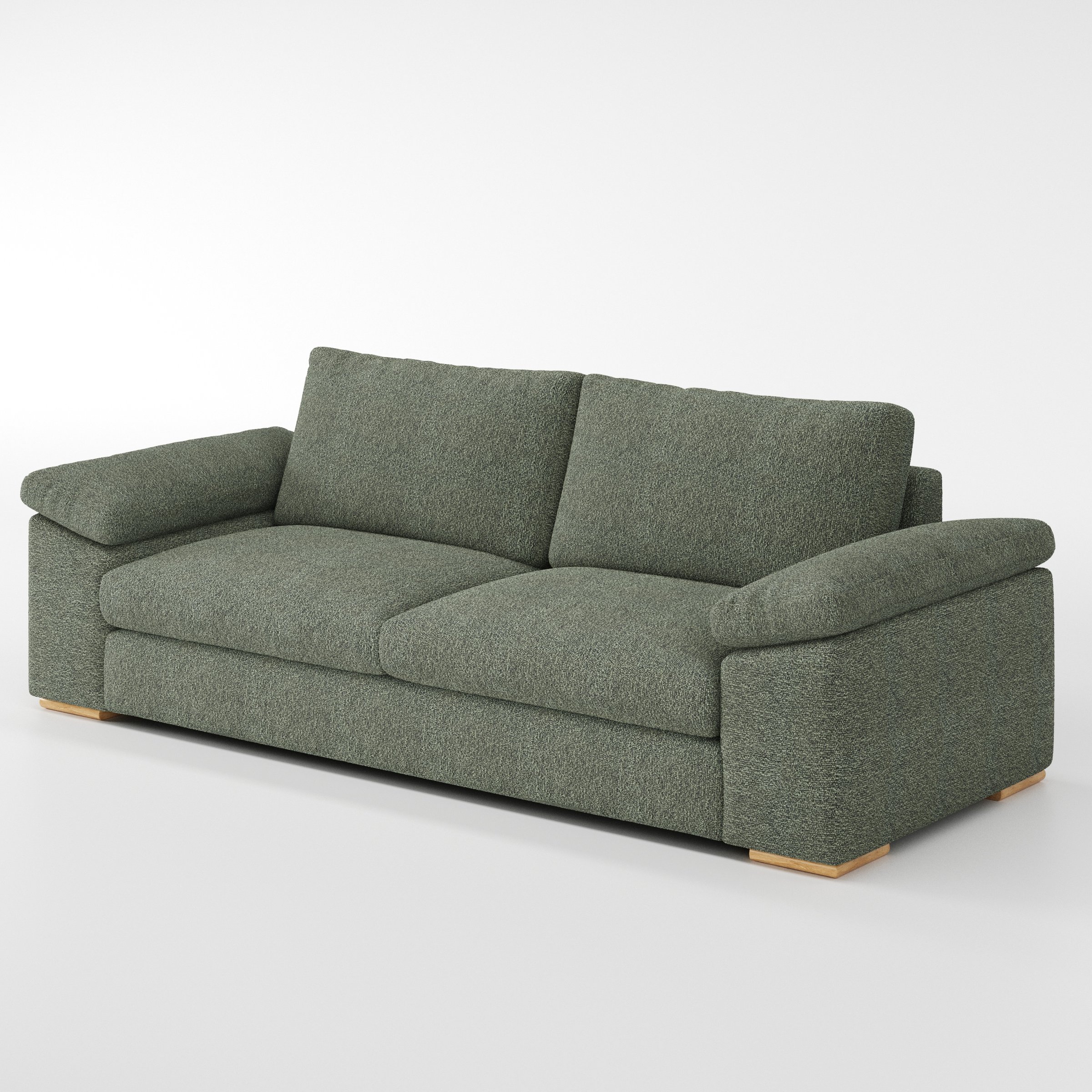 Moy sofa in Kilda Boucle Moss shown at a diagonal angle highlighting arm profile and seat depth.
