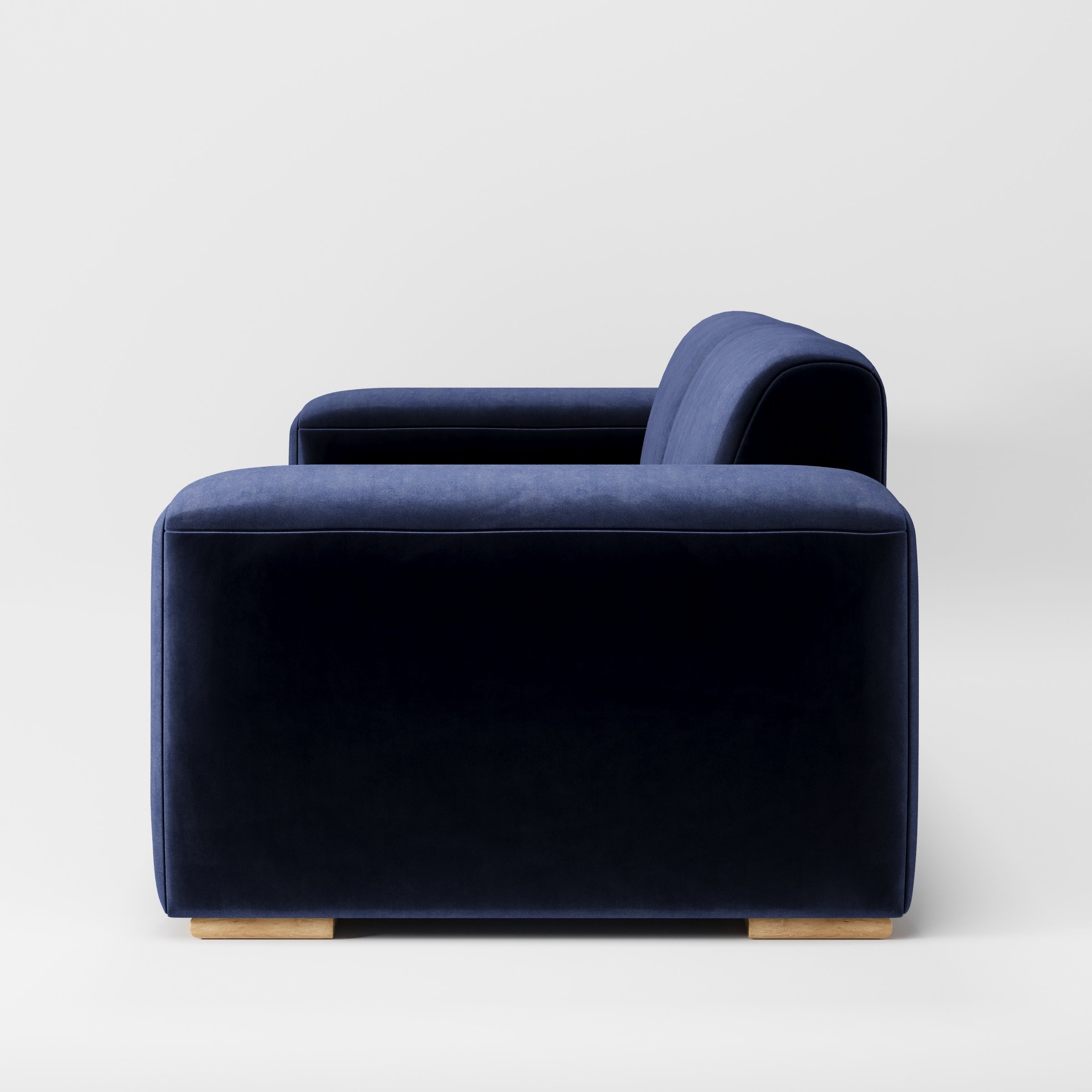 Darwell sofa in Noss Velvet Navy shown in side profile displaying proportions and overall silhouette.