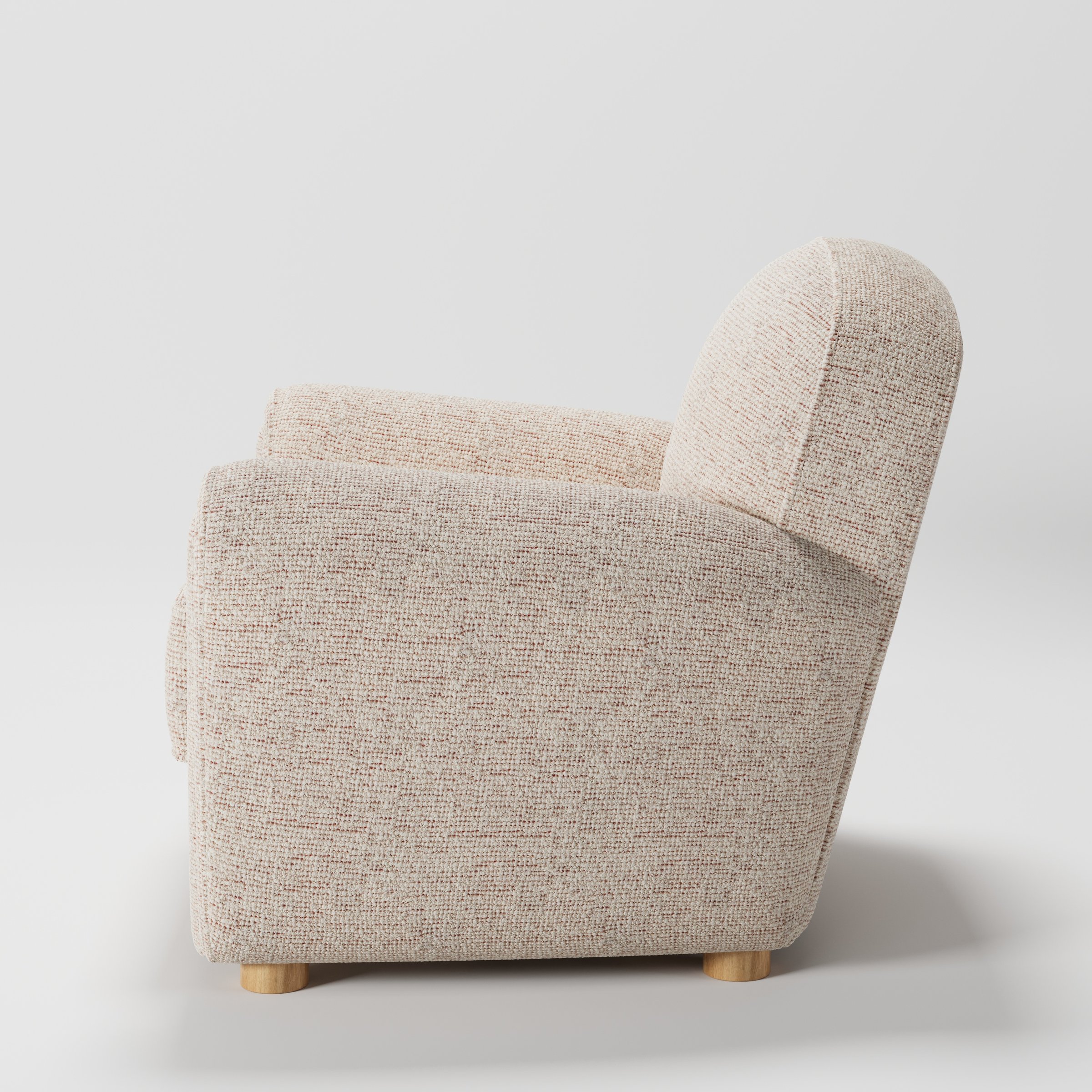 Fergus armchair in Orsay Boucle Cream and Copper shown in side profile displaying proportions and overall silhouette.