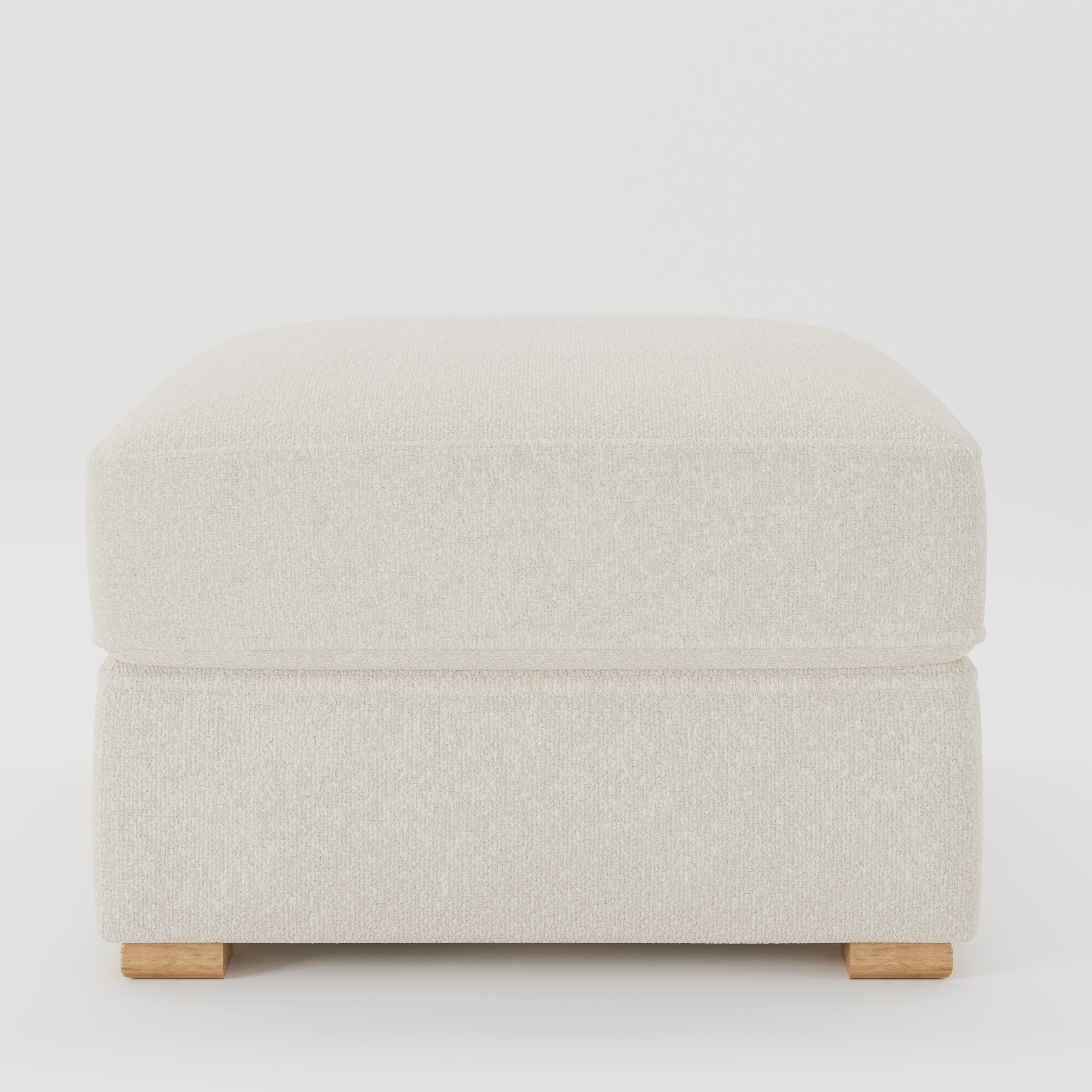 Cashel footstool in Kilda Boucle Cream shown front-on against a neutral studio backdrop.