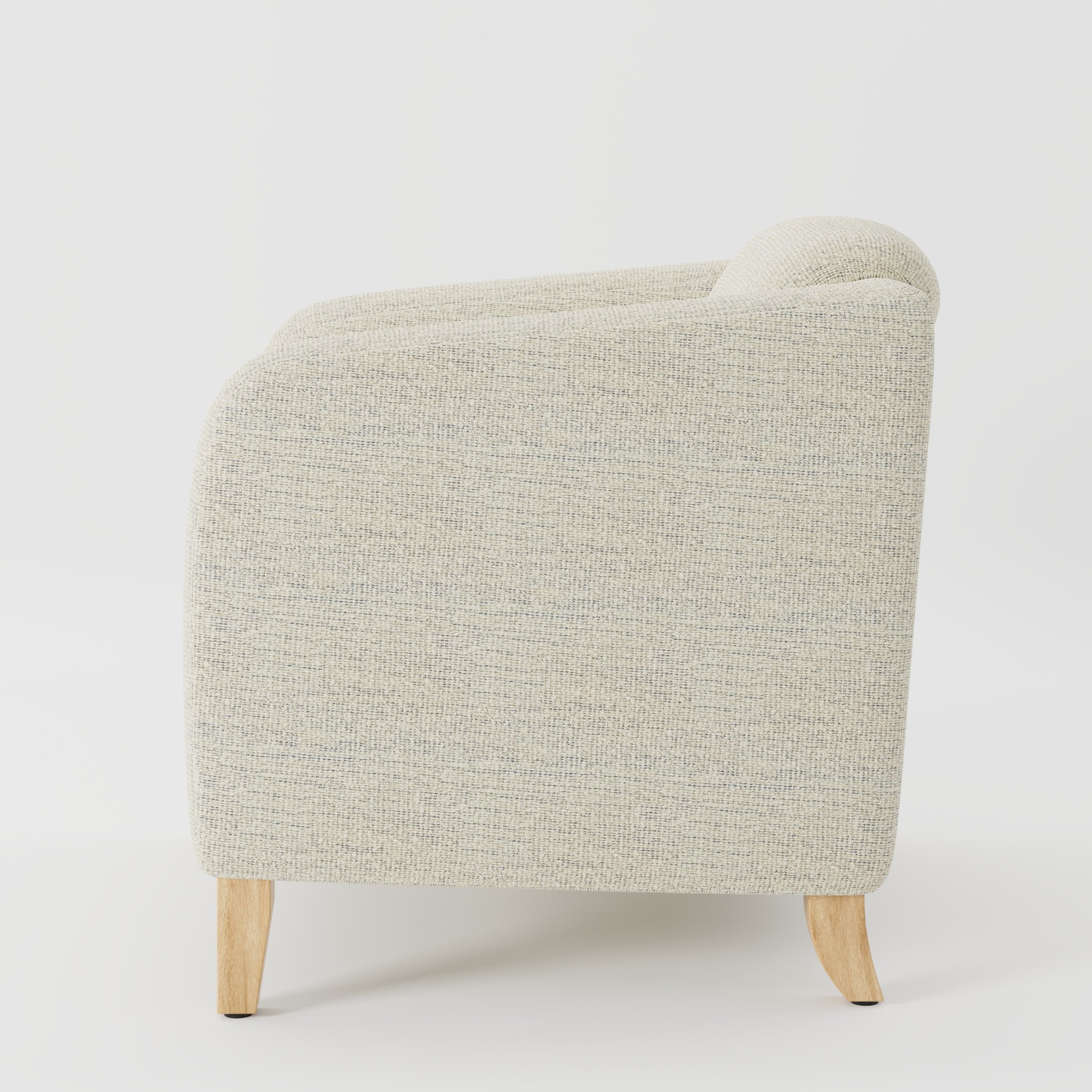Erne armchair in Orsay Boucle Cream and Marine shown in side profile displaying proportions and overall silhouette.