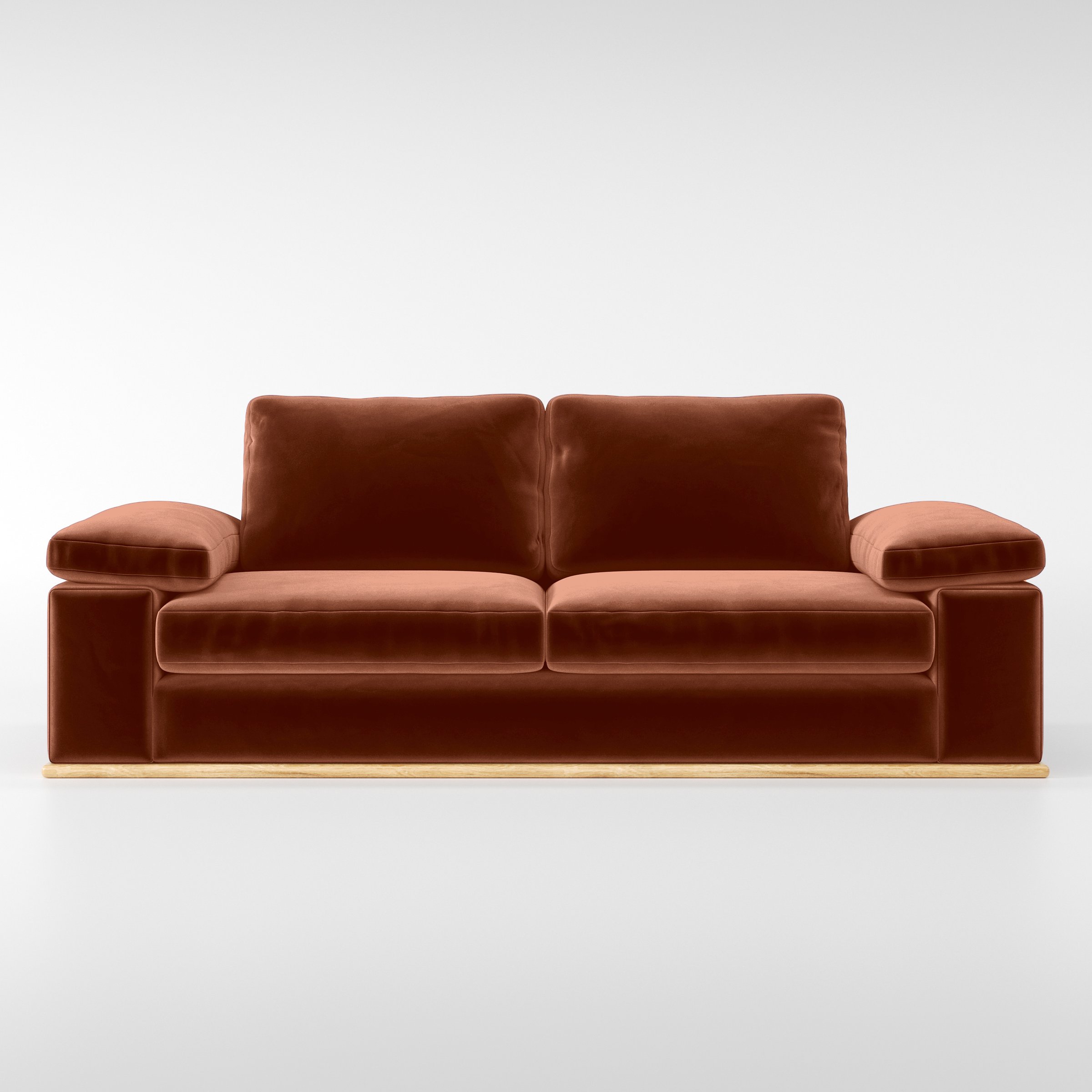 Front view of the Cusher sofa upholstered in Plush EasyClean Velvet in Apricot.