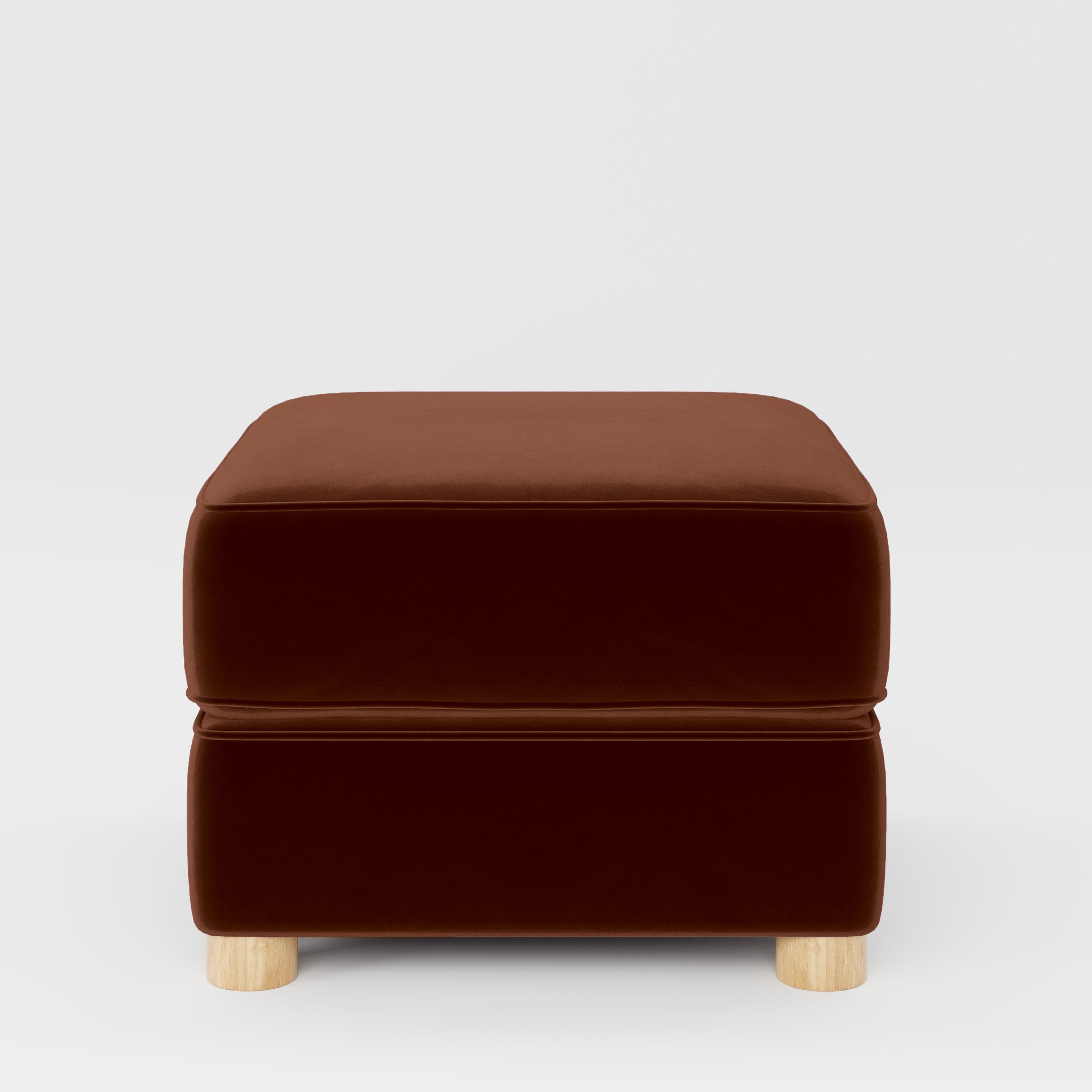 Front view of the Fergus footstool upholstered in Plush EasyClean Velvet in Maple.