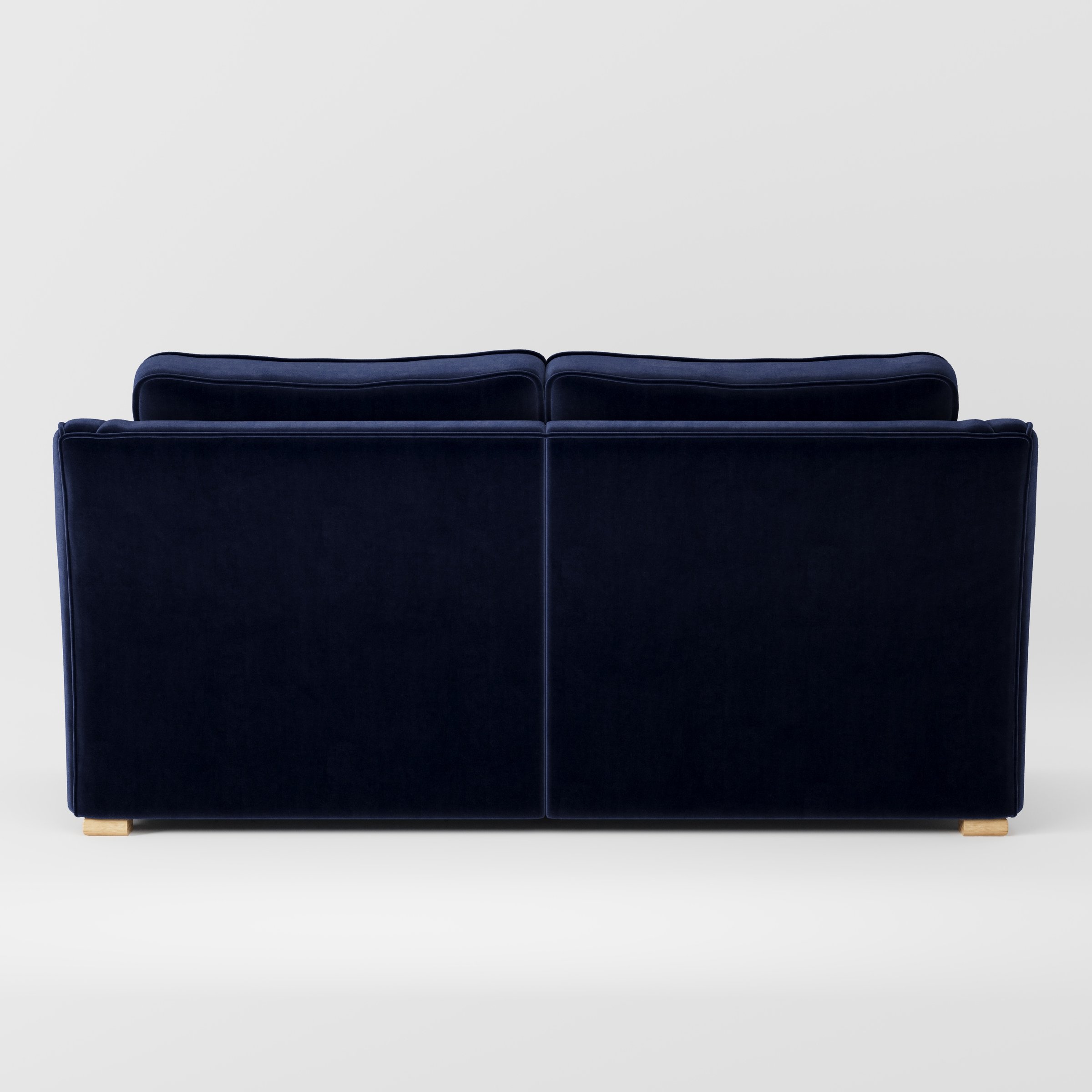 Cashel sofa in Noss Velvet Navy shown from the rear highlighting back cushions and upholstery finish.