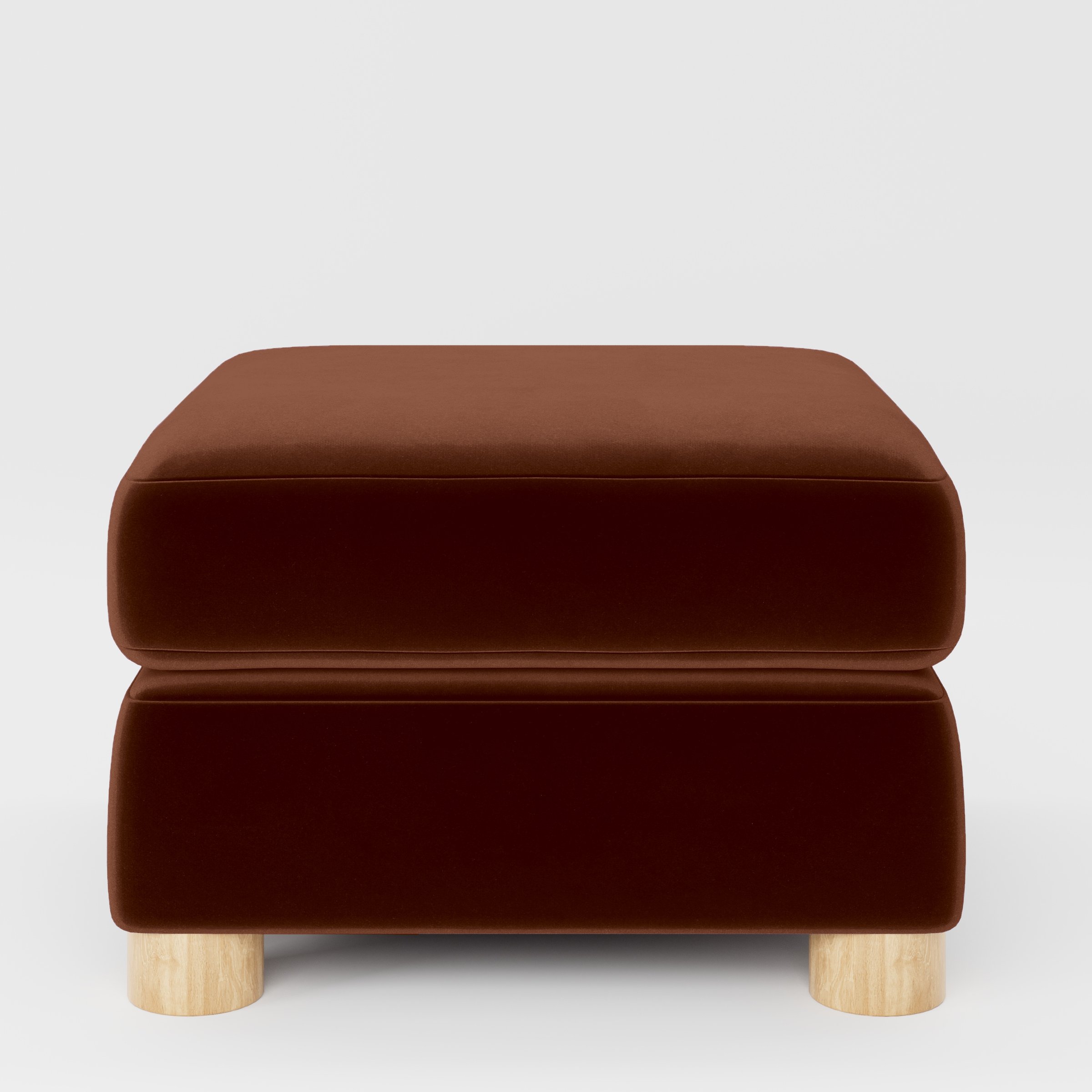 Front view of the Windermere footstool upholstered in Plush EasyClean Velvet in Maple.