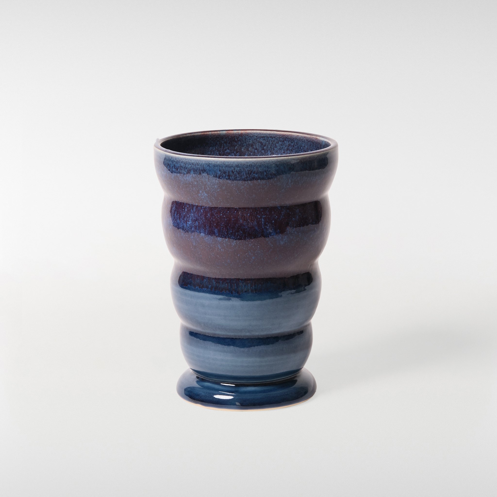 Loam Vase 2 in blue tonal glaze, sculptural ceramic vase with curved stacked form