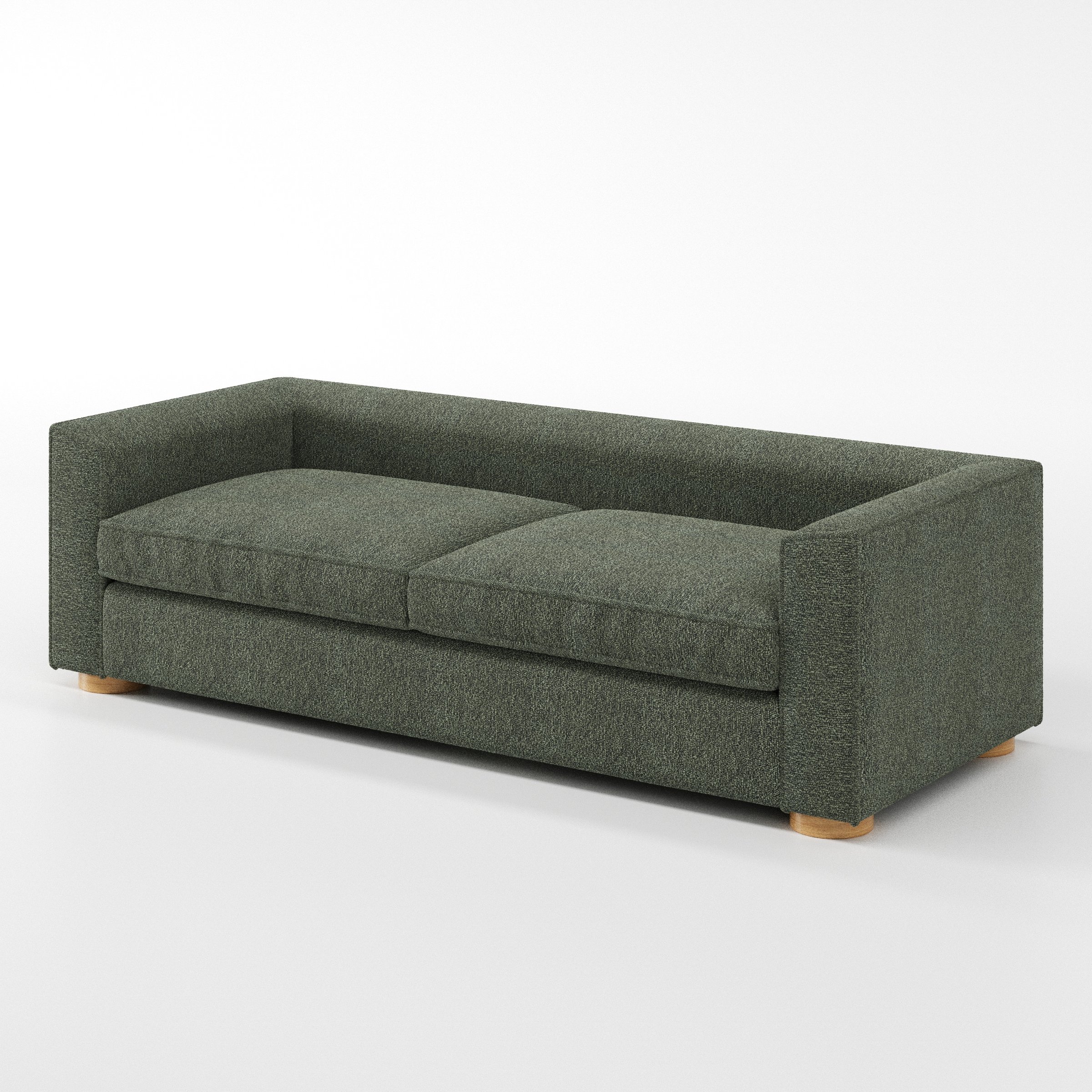 Feale sofa in Kilda Boucle Moss shown at a diagonal angle highlighting arm profile and seat depth.