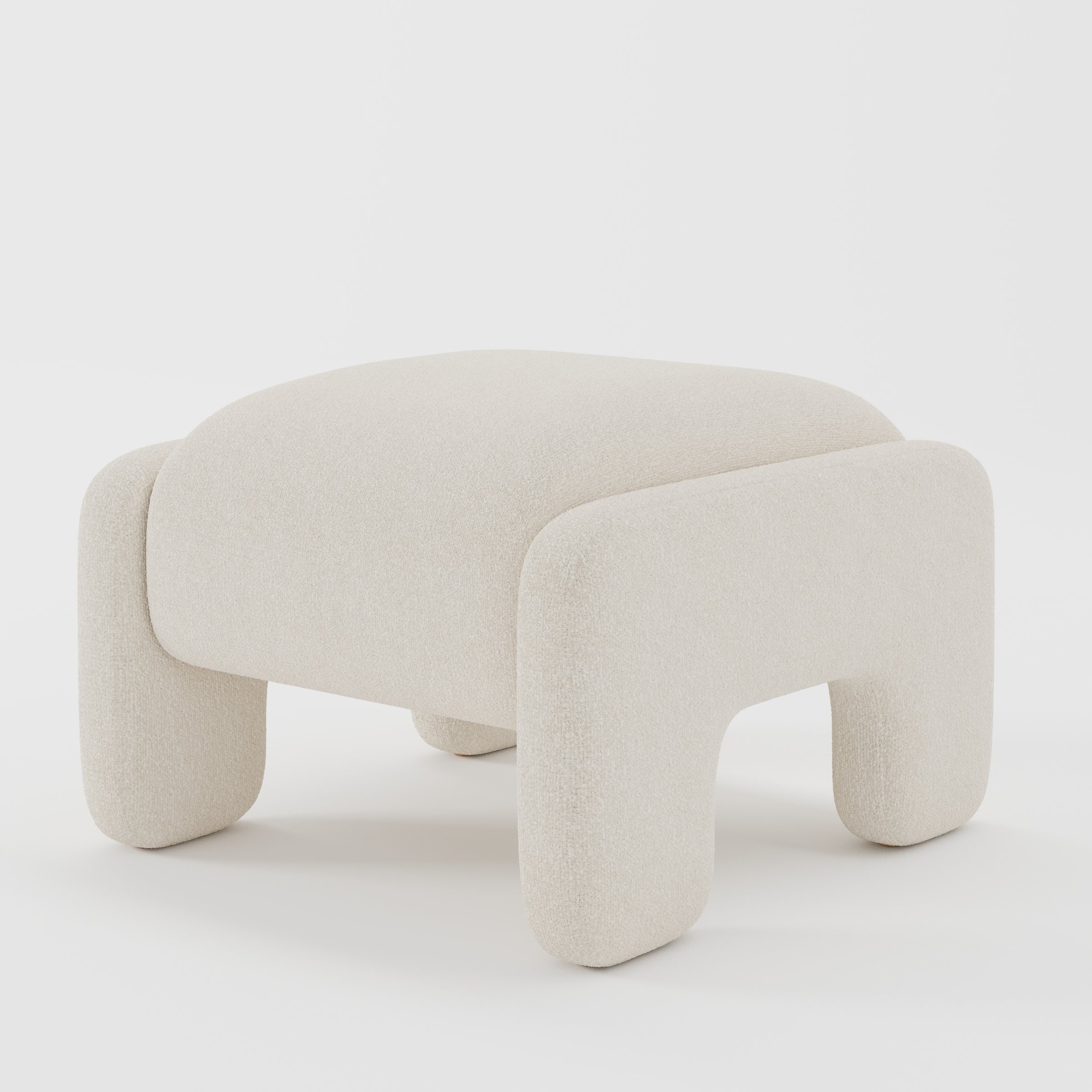 Inny footstool in Kilda bouclé cream fabric, diagonal view highlighting curved silhouette and subtle texture