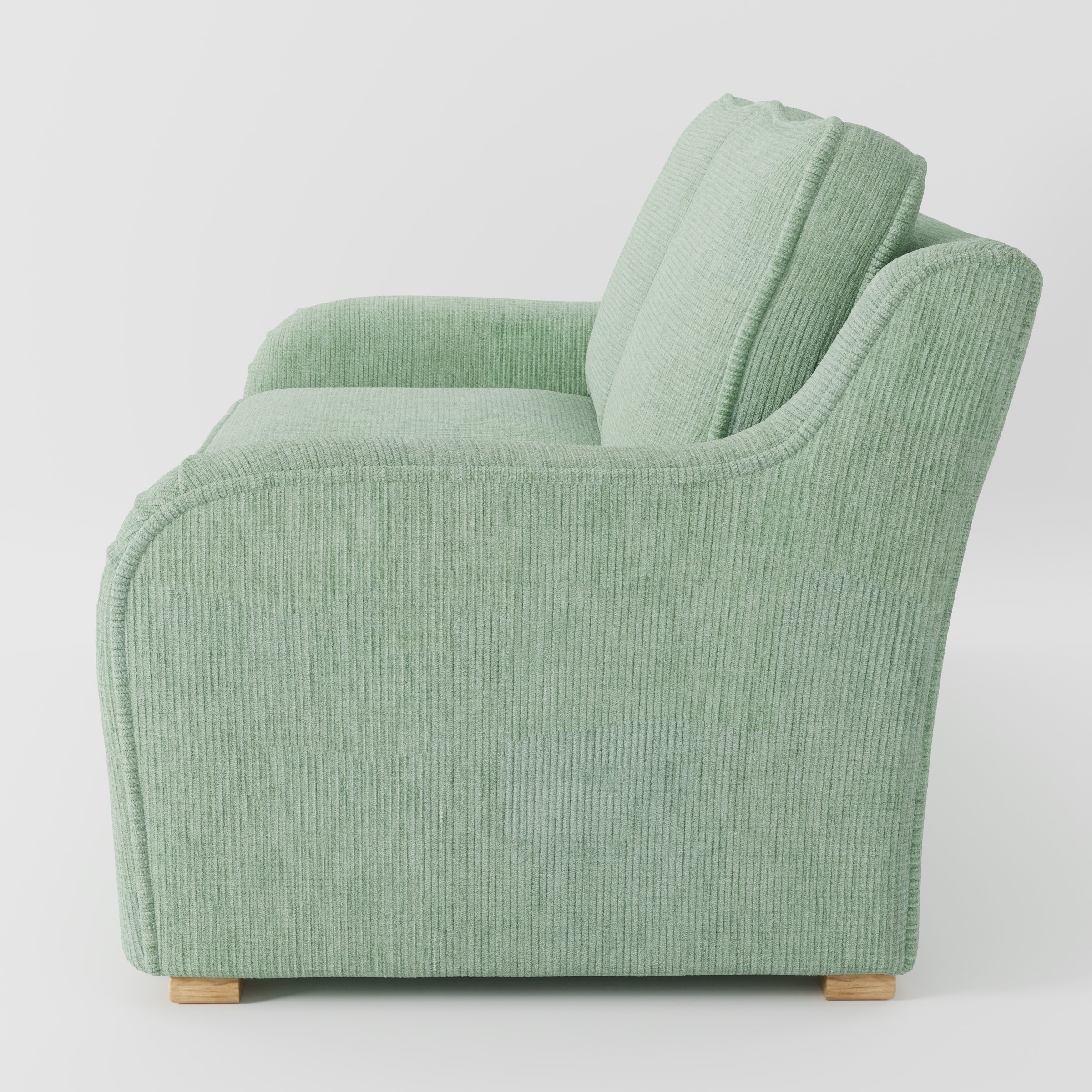 Cashel sofa in Caldey Velvet Corduroy Eucalyptus shown in side profile displaying proportions and overall silhouette.