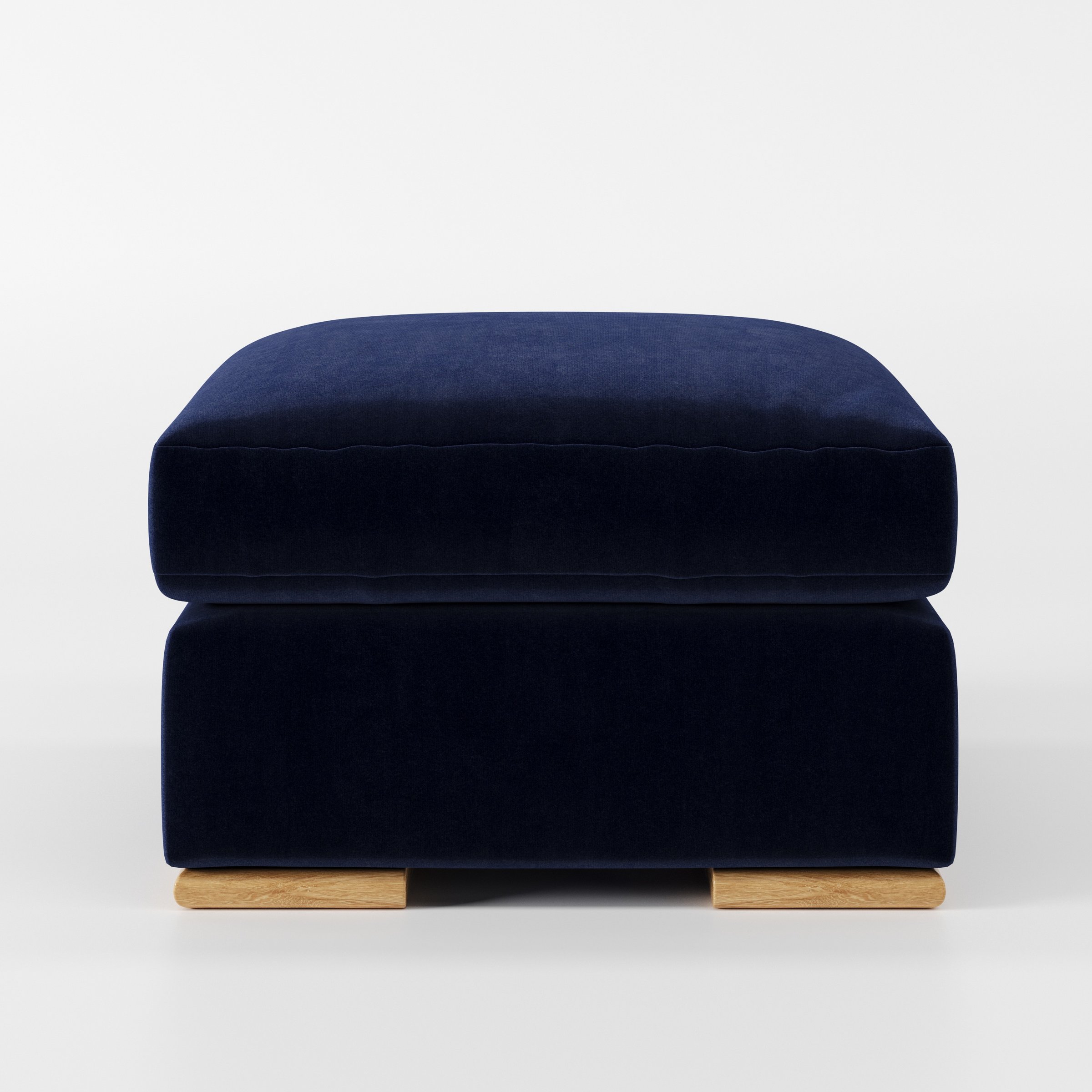 Moy footstool in Noss Velvet Navy shown front-on against a neutral studio backdrop.