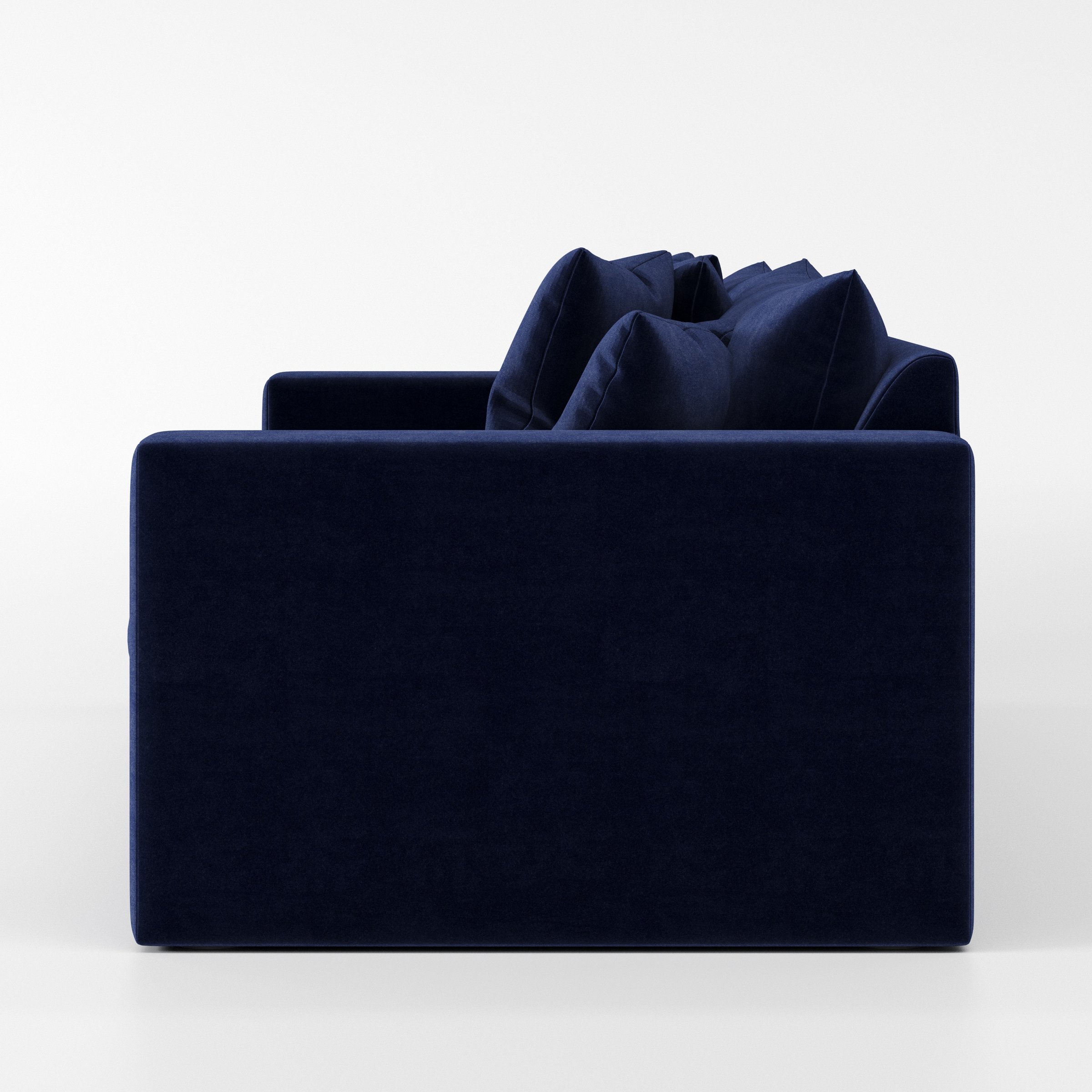 Coniston sofa in Noss Velvet Navy shown in side profile displaying proportions and overall silhouette.