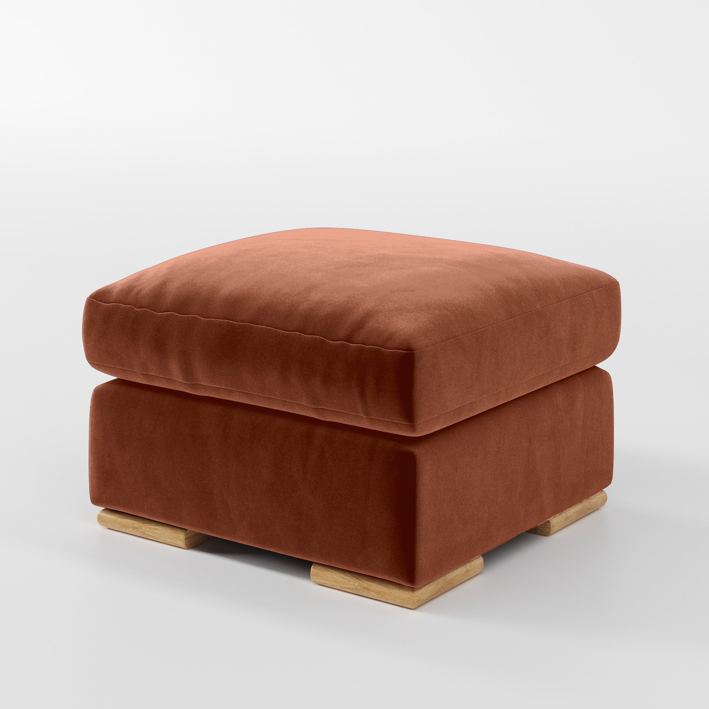 Diagonal view of the Fane footstool upholstered in Plush EasyClean Velvet in Apricot.