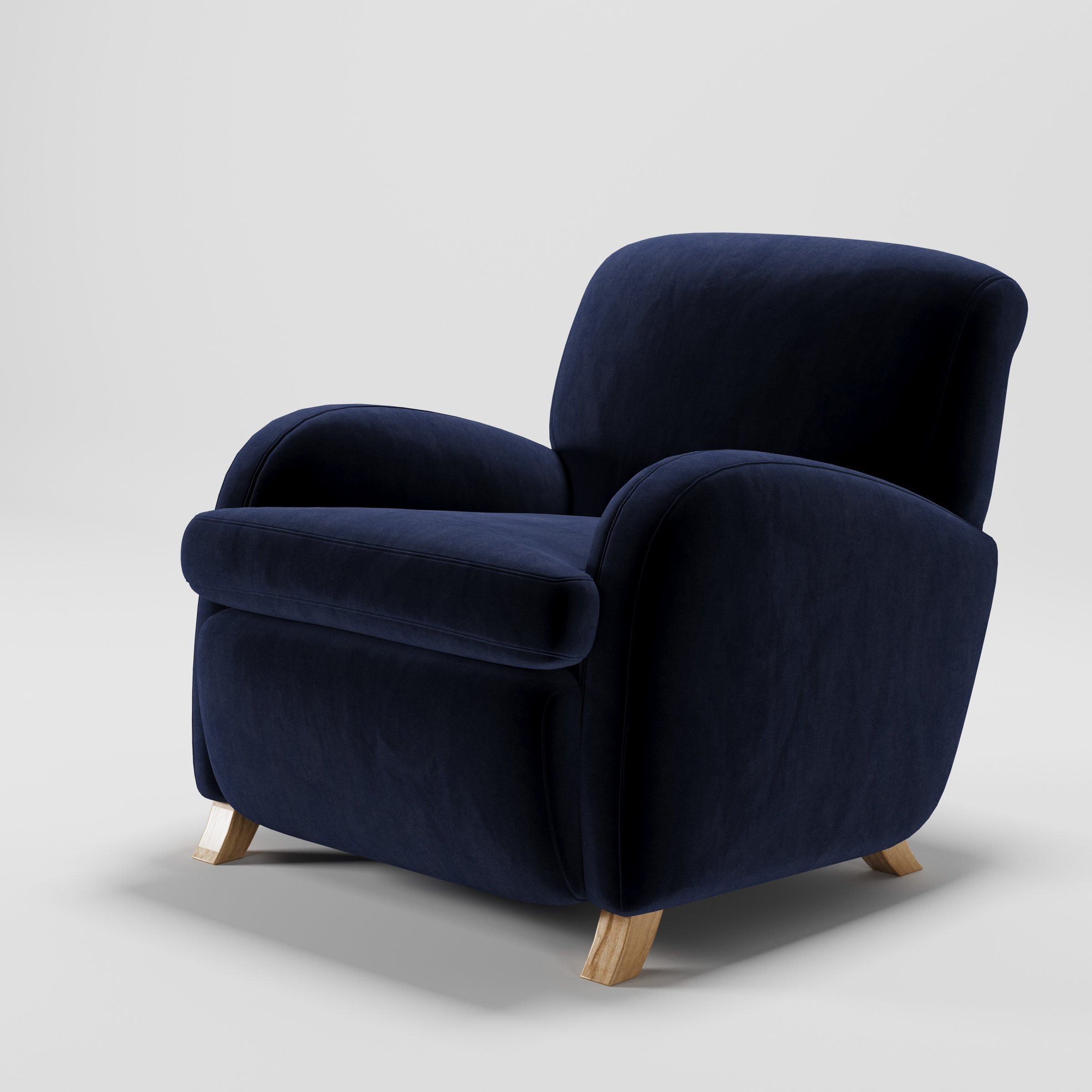 Rye armchair in Noss Velvet Navy shown at a diagonal angle highlighting arms and seat depth.