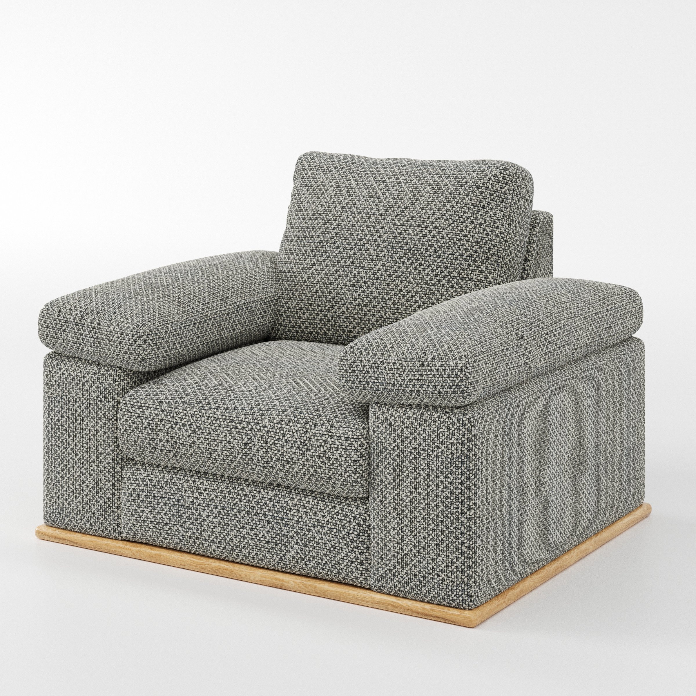 Cusher armchair in Rousay Wool Blend Tar and Chalk shown at a diagonal angle highlighting arms and seat depth.