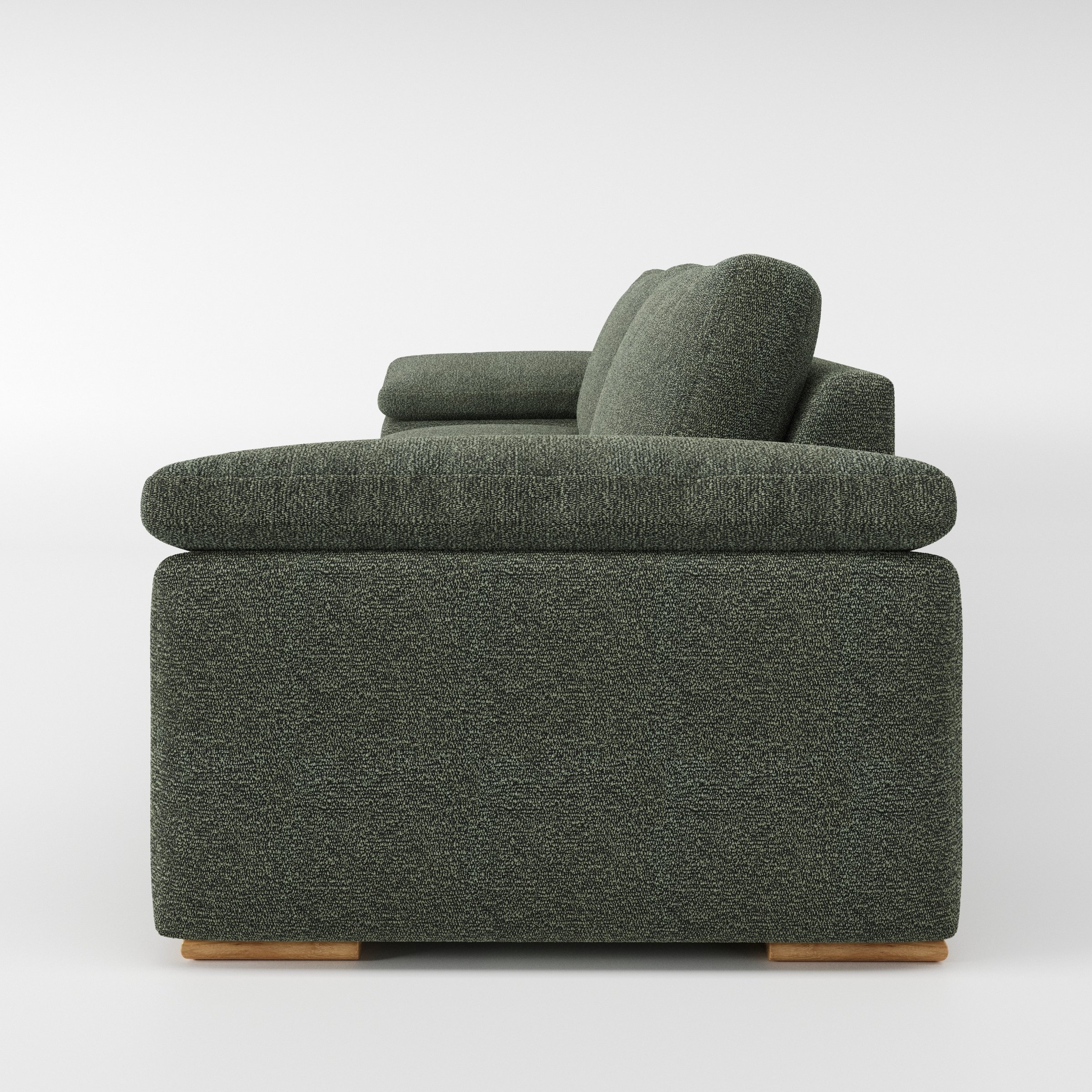 Moy sofa in Kilda Boucle Moss shown in side profile displaying proportions and overall silhouette.