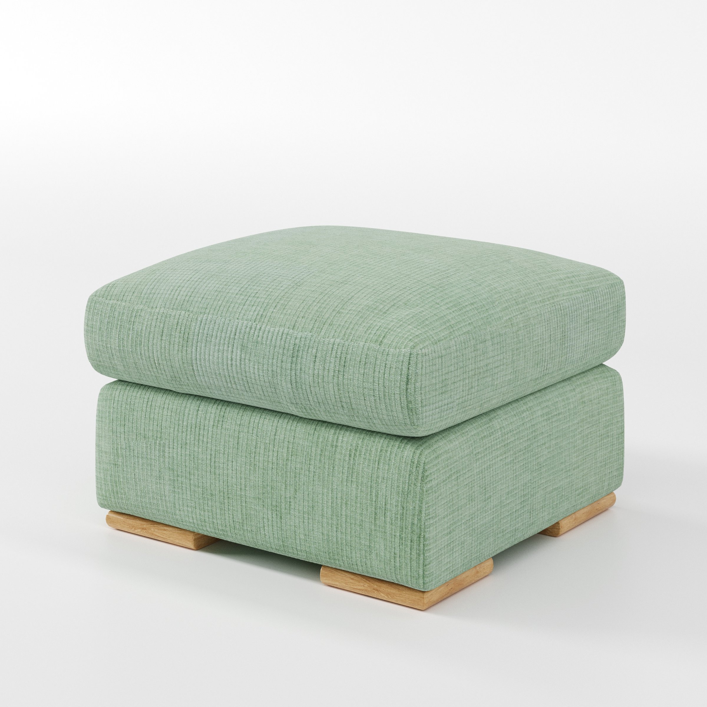 Moy footstool in Caldey Velvet Corduroy Eucalyptus shown at a diagonal angle highlighting deep cushioning and low wooden base.