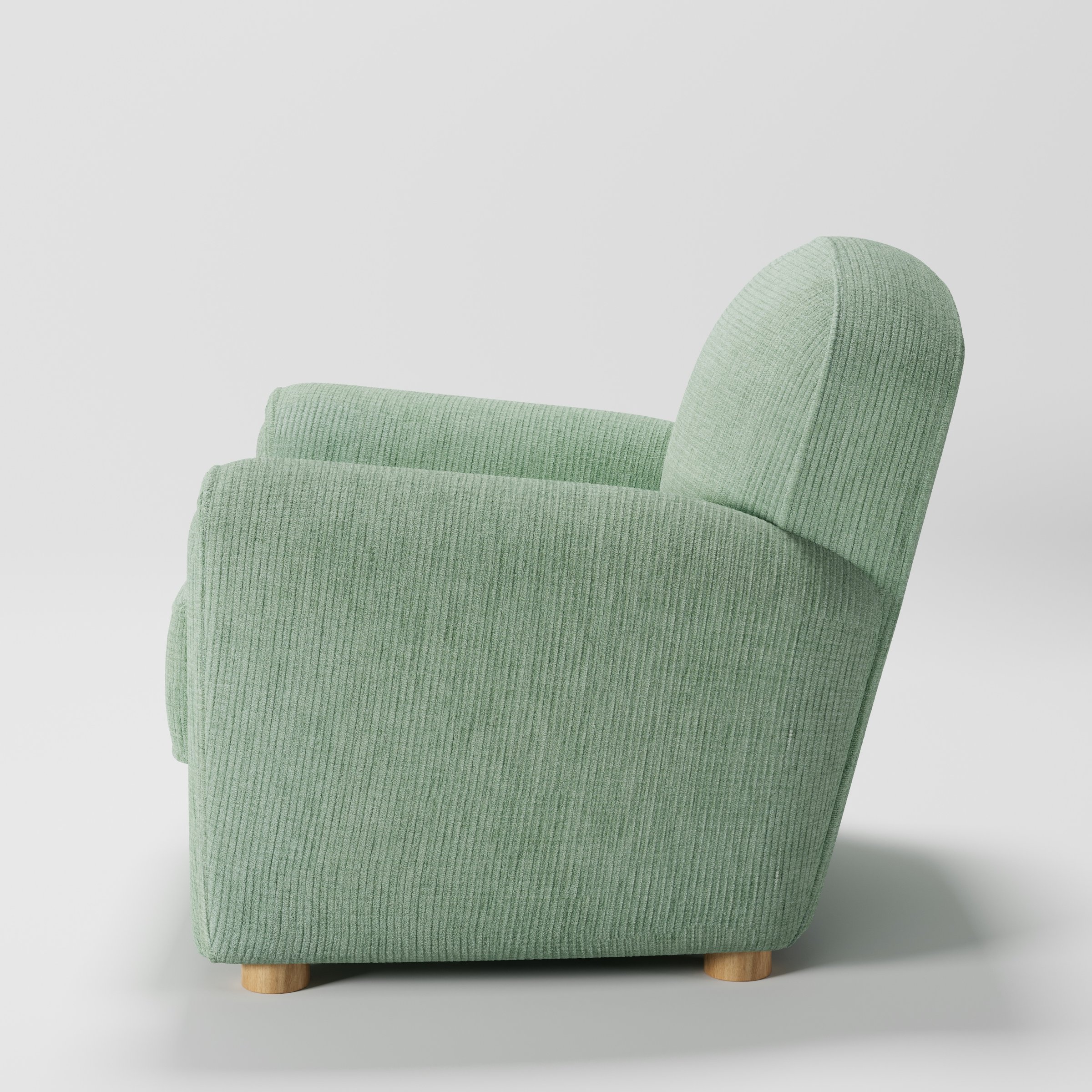 Fergus armchair in Caldey Velvet Corduroy Eucalyptus shown in side profile displaying proportions and overall silhouette.
