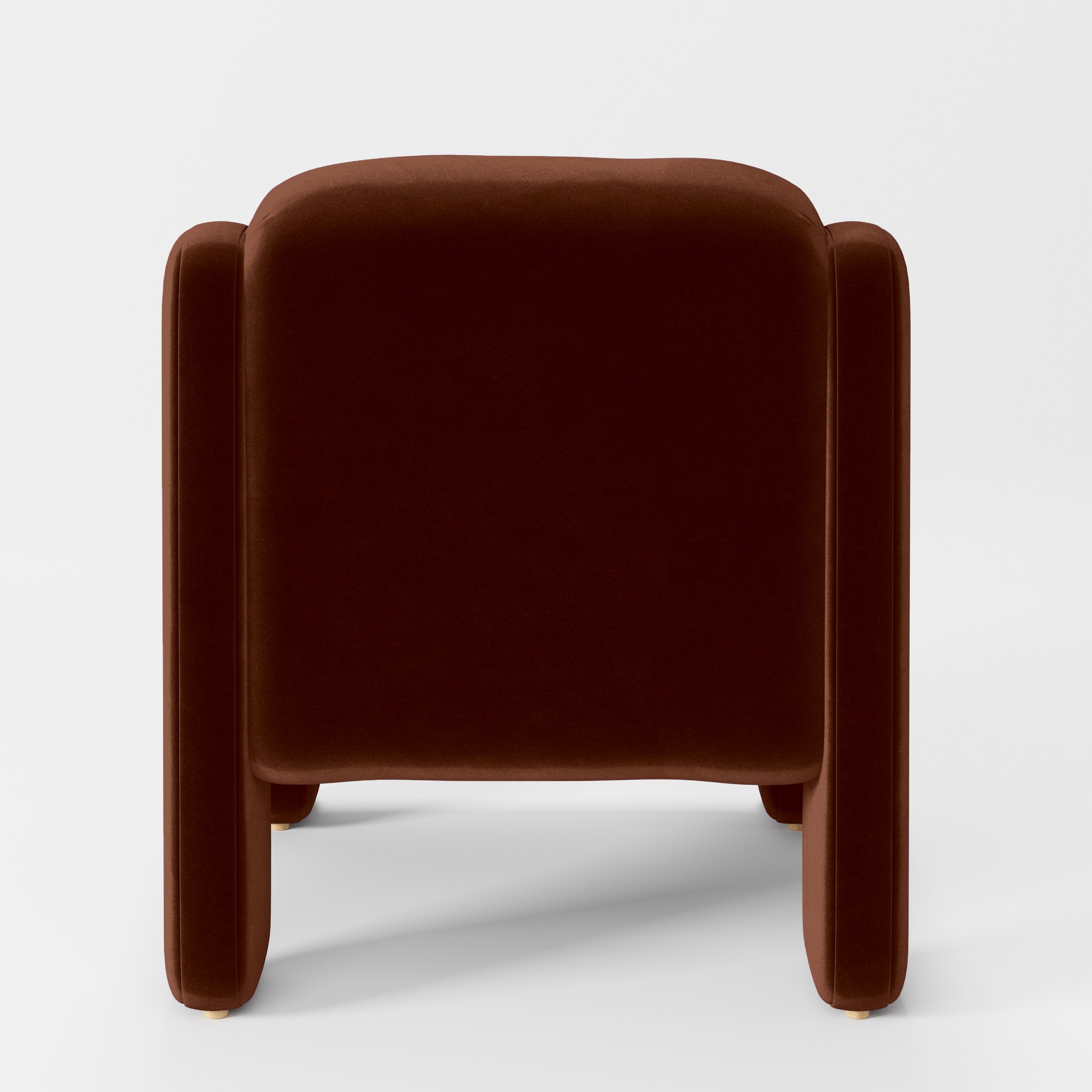 Rear view of the Inny armchair upholstered in Plush EasyClean Velvet in Maple.