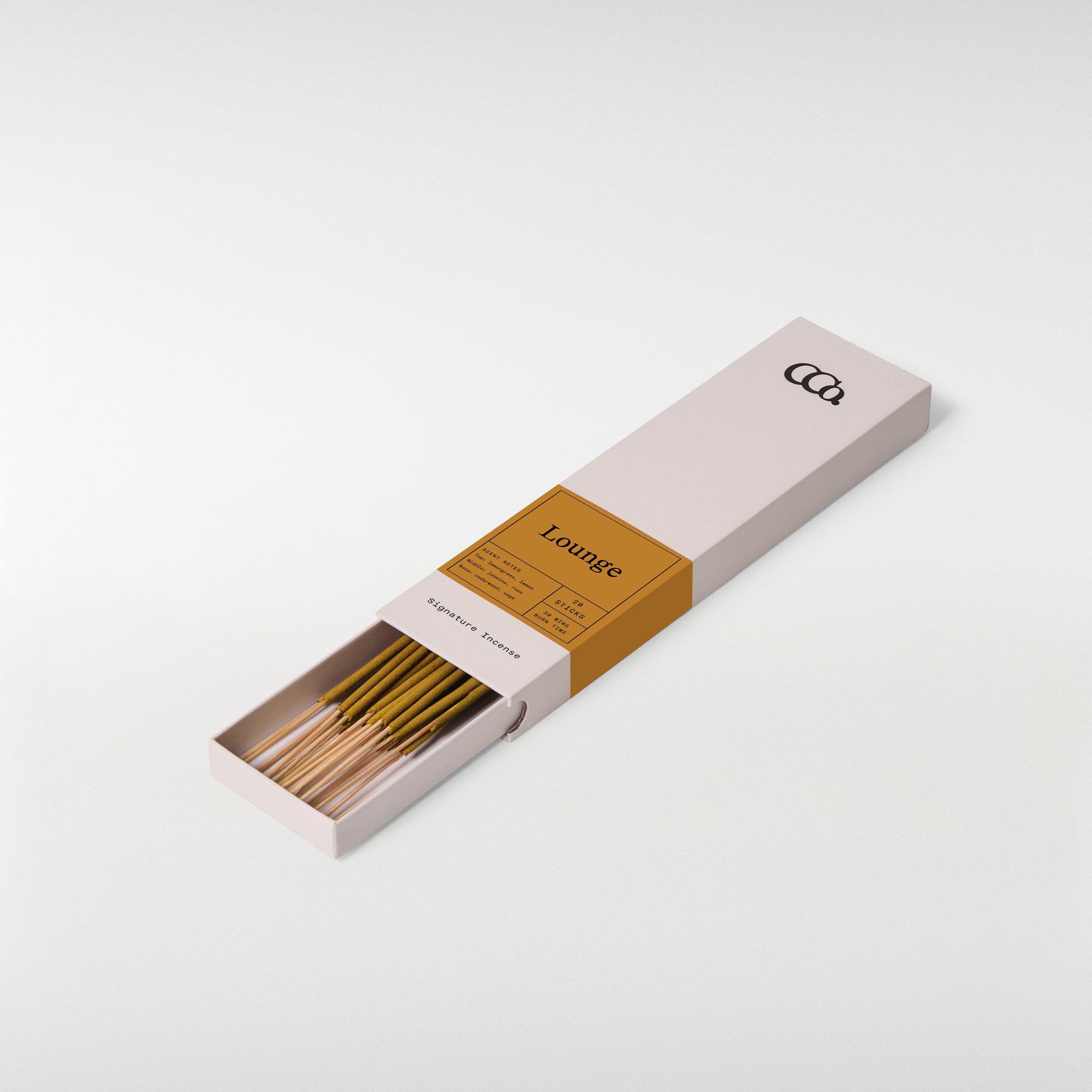 Lounge incense, 8 inch sticks in a minimal sliding box with warm ochre label, partially open showing neatly arranged incense sticks with bright citrus, soft floral, and warm wood scent notes