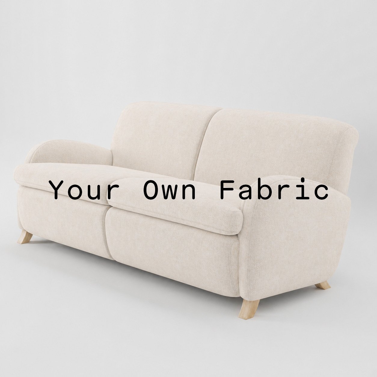 Diagonal view of the Rye sofa upholstered in customers own material calico cotton fabric.