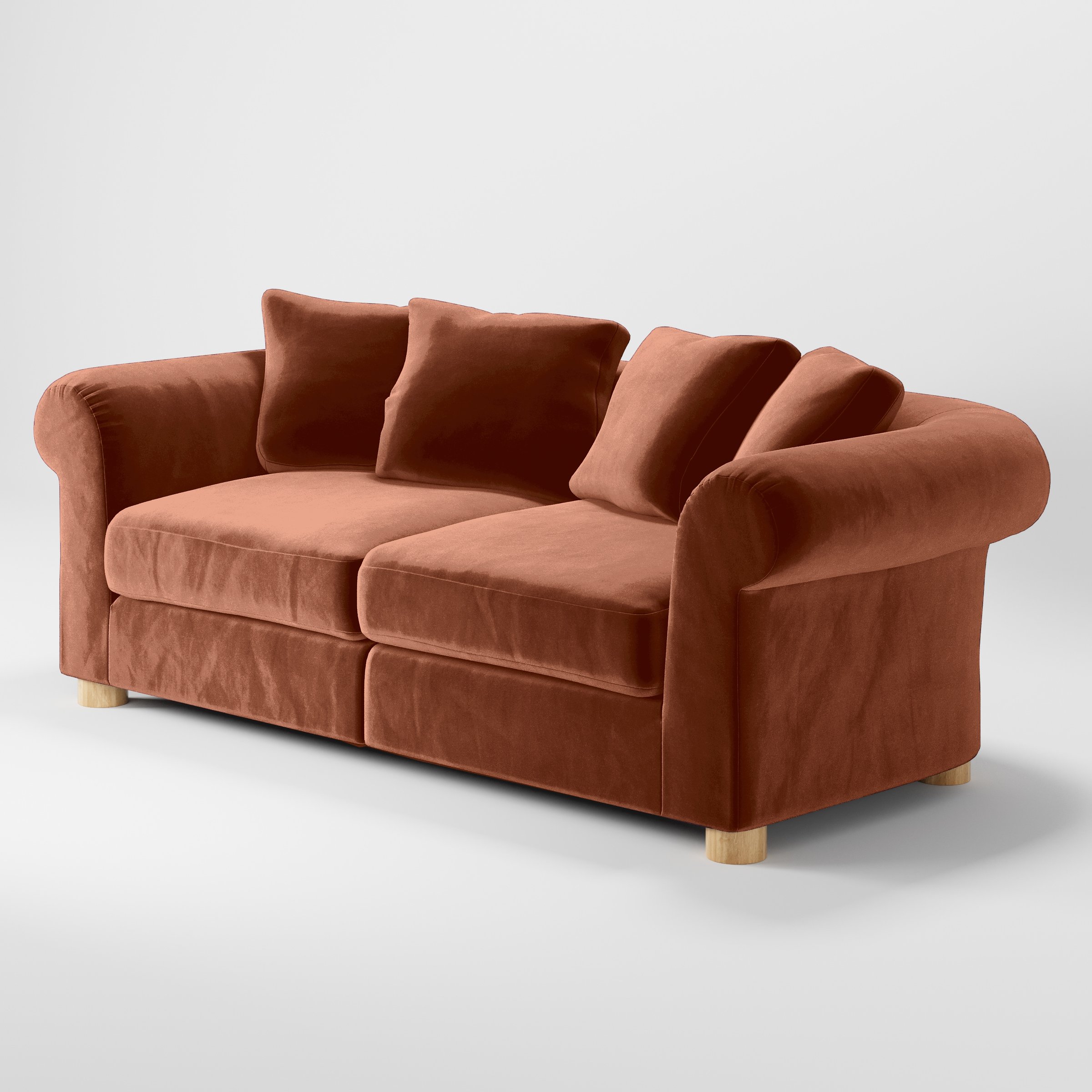 Diagonal view of the Windermere sofa upholstered in Plush EasyClean Velvet in Apricot.